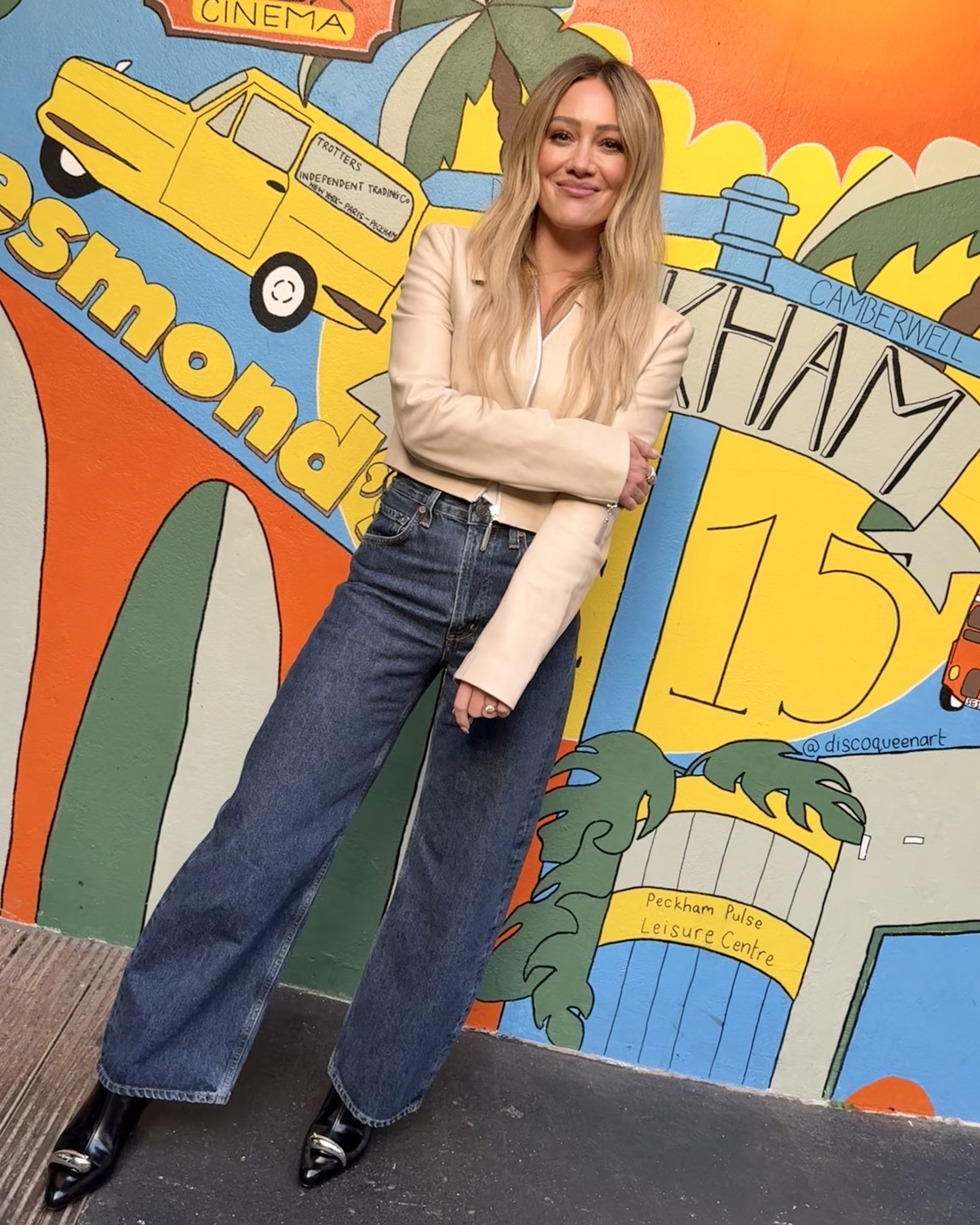 Hilary Duff wide leg high waist jeans zip front leather jacket, embellished leather ankle boots at the I-D Album Interview February 18, 2026