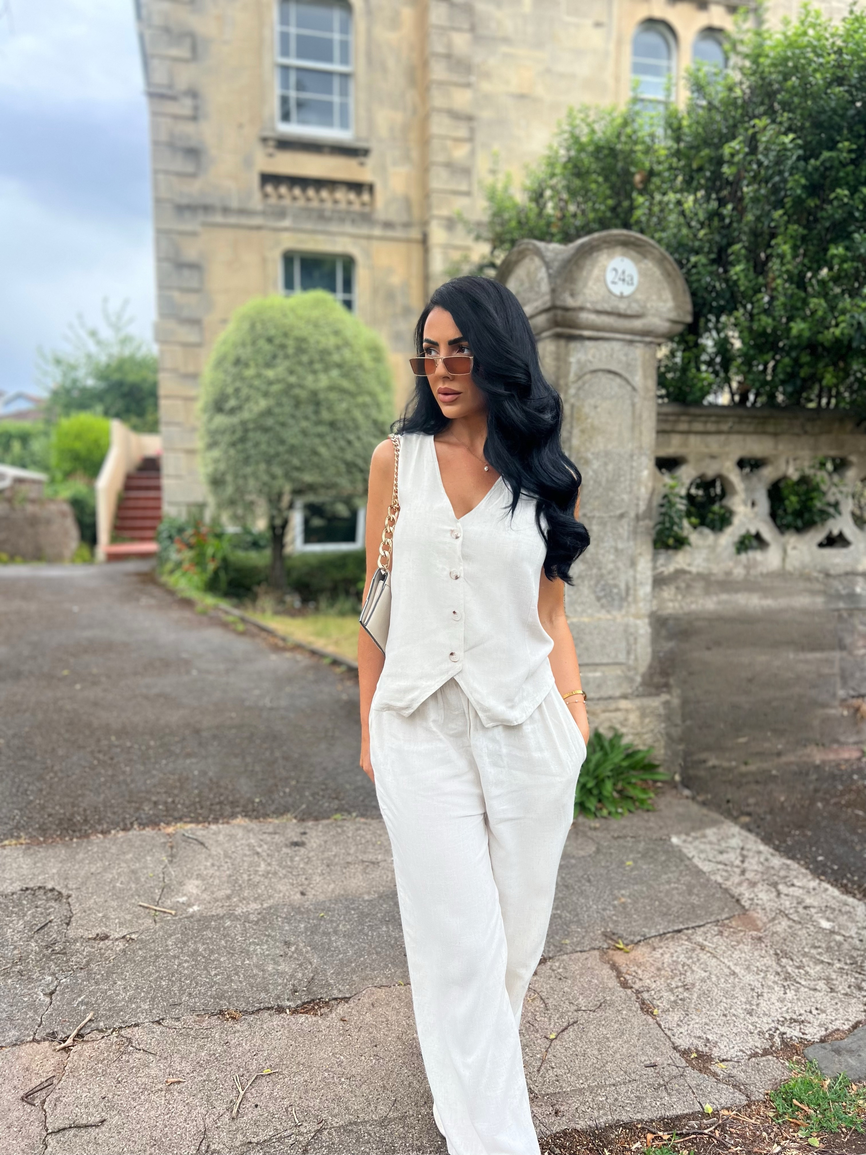 Embracing the warmer days in this chic and effortless linen set ☀️🤍
This waistcoat + trouser combo is giving relaxed elegance — lightweight, flowy, and so flattering. Perfect for a summer holiday, brunch date, or casual days when you still want to look put together.

Wearing size S/M — the fit is relaxed but structured in all the right places. The linen is breathable and soft, making it ideal for warm days.

I styled it with pearl gold earrings, stacked gold bracelets, and a beige bag with a gold chain handle to keep things polished but easy. Could totally dress this up with heels or keep it casual with slides 🌿 

 #LTKsummer #LTKtravel #LTKdresses