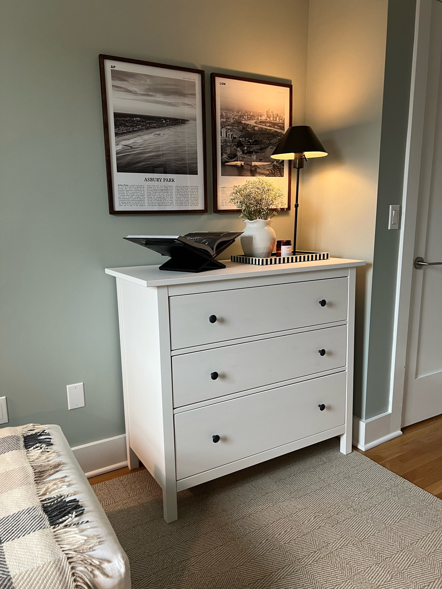 Bring your travels to your bedroom with these prints! Black accents like the frames, book stand, and lamp make the space feel modern and stylish. Shop now to elevate your home decor!

#interiordesign #bedroomgoals #bedroomdecor #blackframes #gallerywall #prints #london #asburypark #ltkhome

#LTKhome