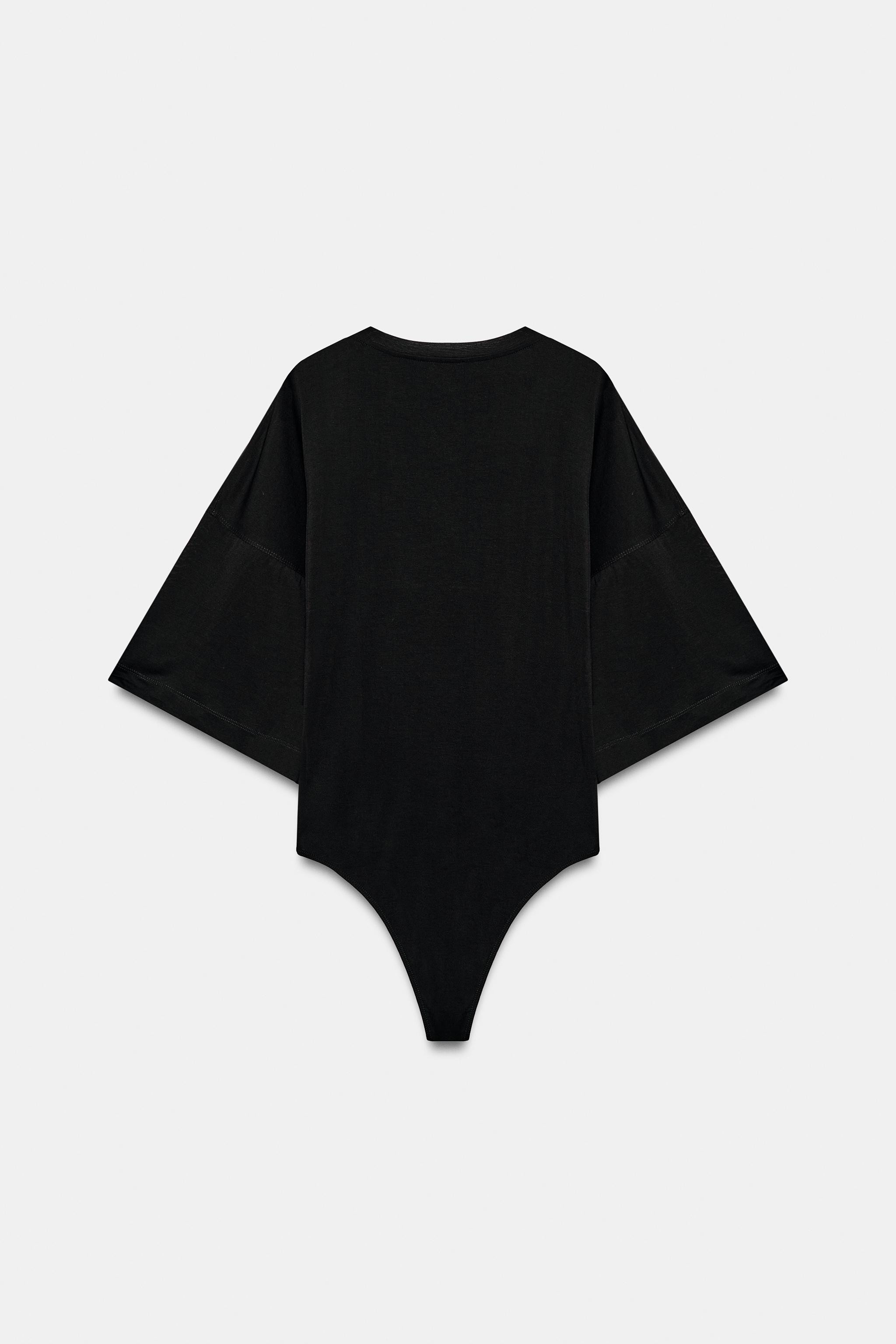 Bodysuit made from lyocell yarn. Round neck and below-the-elbow sleeves. Bottom snap button closu... | Zara US
