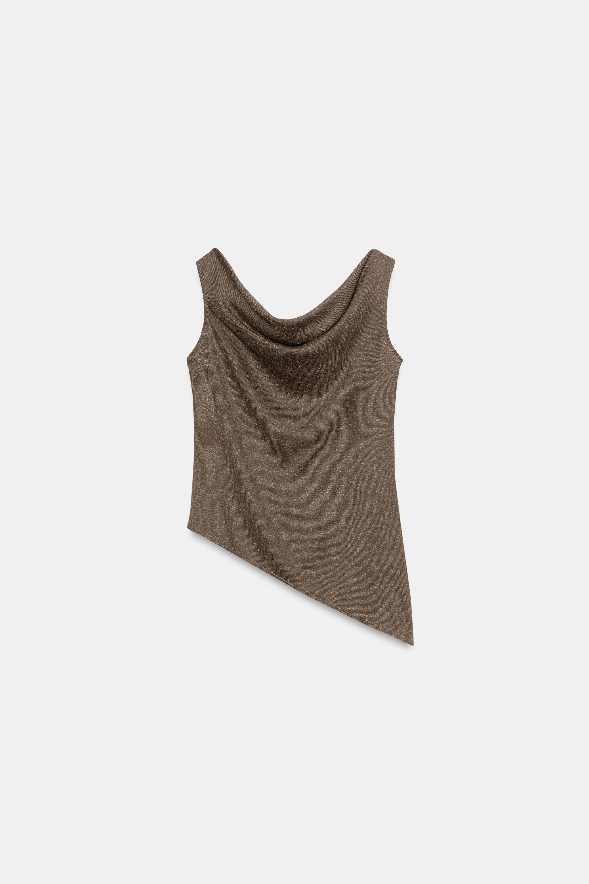 Top made from rustic fabric. Asymmetric neckline and short sleeves. Draped detail. Asymmetric hem... | Zara US