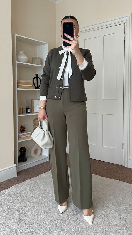 Spring workwear outfit. Bow blouse is from Mango, wearing size S. Cardigan is from H&M, wearing size M. Trousers are from &OtherStories, wearing size UK10. Handbag is from PoleneParis. 

#LTKmodest #LTKworkwear #LTKeurope