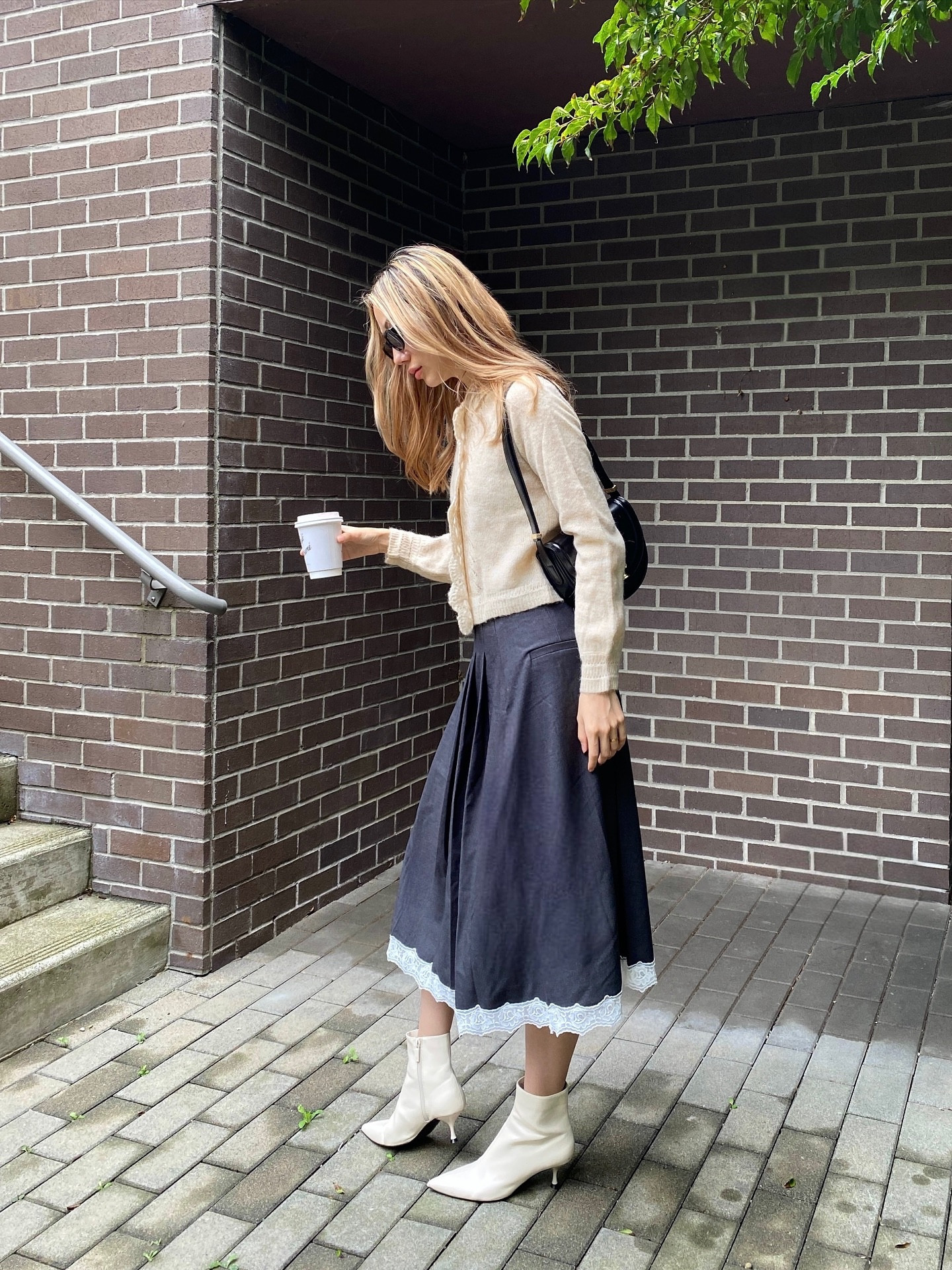 Fall is the best season for fashion, agree or disagree? 👀
.
Cardigan & skirt are from @simpleretro I love this lace trimmed skirt so much, will be wearing on repeat 🔁 
.
.
Modest outfit, modest fall fashion, modest style, fall outfit ideas, midi skirt outfit, minimal street style, pose idea, beige outfit ideas