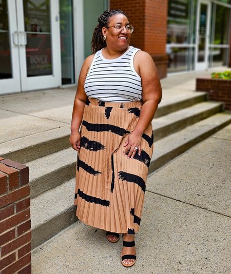 Brush print skirt. Light brown and black. I'm wearing a 3XL. I bought it from Temu. It's also available at SHEIN.

#LTKPlusSize #LTKFindsUnder50
