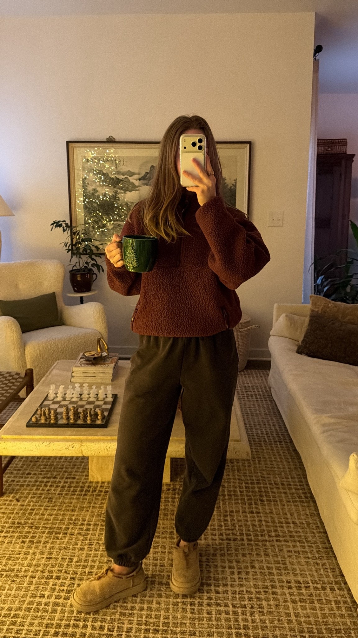 12/24/25 my Christmas Eve morning lounge outfit — fully leaned into cozy mode. I’m wearing my Athleta brown jogger fleece sweatpants paired with my burgundy quarter-zip fleece from Aritzia, which is the perfect warm-but-comfy combo for a slow holiday morning at home. Soft layers, neutral tones, and that just-woke-up-but-still-put-together feeling that Christmas Eve mornings deserve.