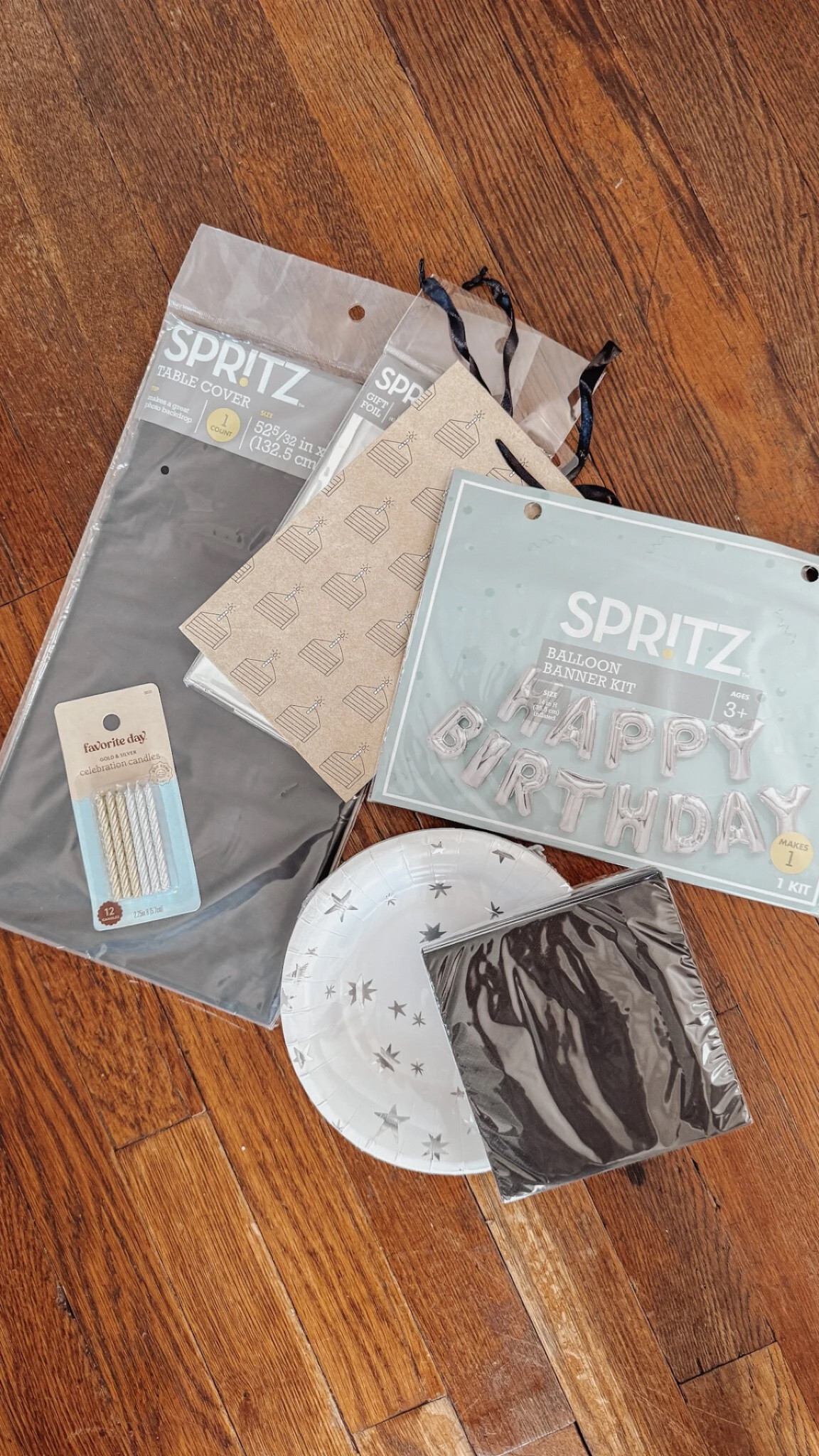 Neutral birthday party decorations including a happy birthday balloon banner, cake plates, & candles 🤍

#LTKFindsUnder50 #LTKFamily #LTKParties