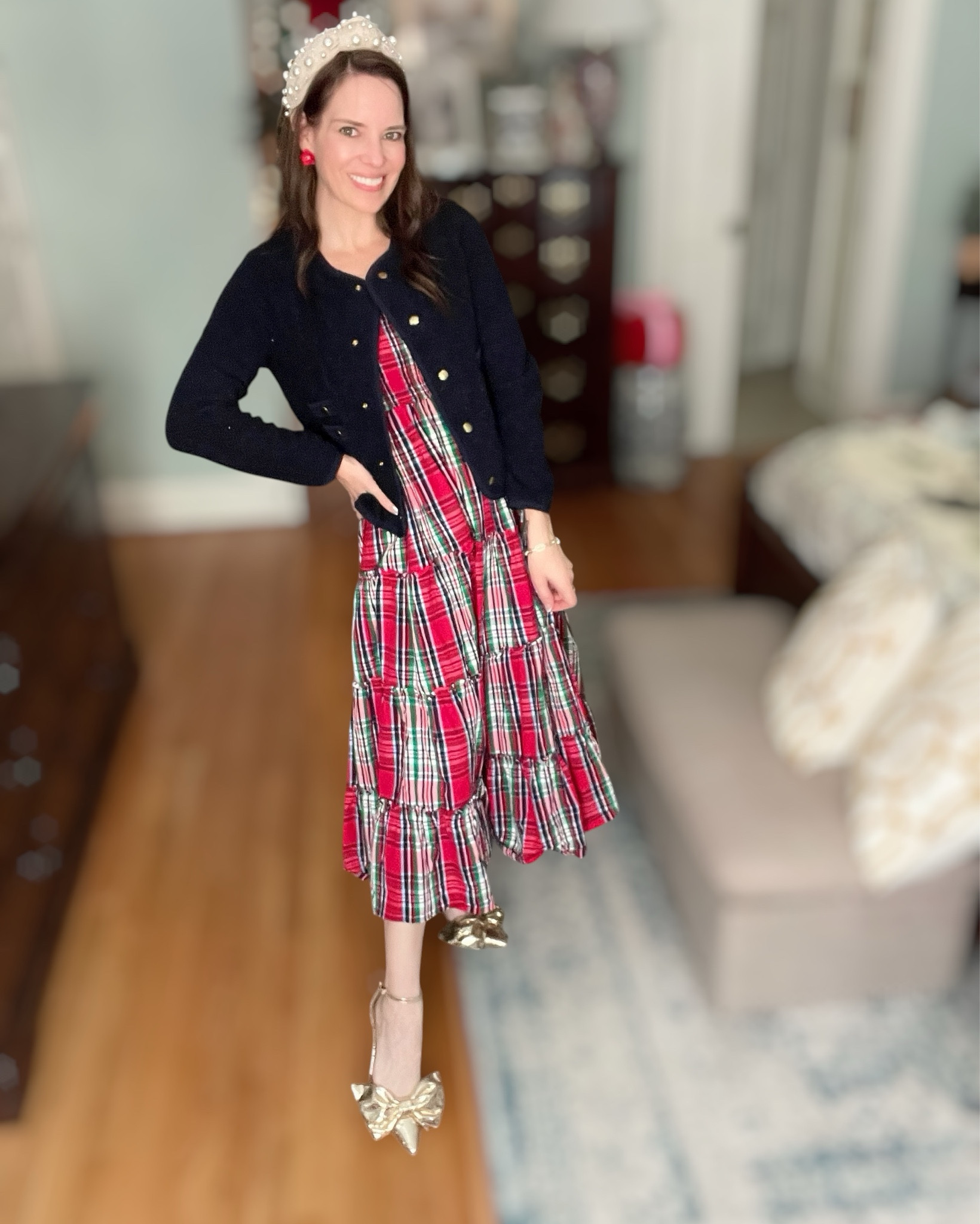 Full holiday magic moment 🎄❤️ This plaid smocked dress is so comfortable and flattering — stretchy on top, flowy through the skirt, and perfect for everything from school parties to Christmas Eve service to cookie decorating at home. I layered it with the softest navy cardigan for that cozy classic look and added my favorite pearl headband for a little princess sparkle ✨ The gold bow heels are the show-stoppers — they make every outfit feel special! And the little red flower studs tie the whole festive vibe together without being too much. So sweet, so cheerful, so holiday.

⸻

christmas plaid dress • holiday party outfit • feminine holiday style • classic christmas plaid • navy cardigan outfit • pearl headband • festive accessories • gold bow heels • holiday family photos outfit ideas • winter church outfit • merry and bright 🎄❤️✨

#LTKFindsUnder100 #LTKHoliday #LTKFindsUnder50