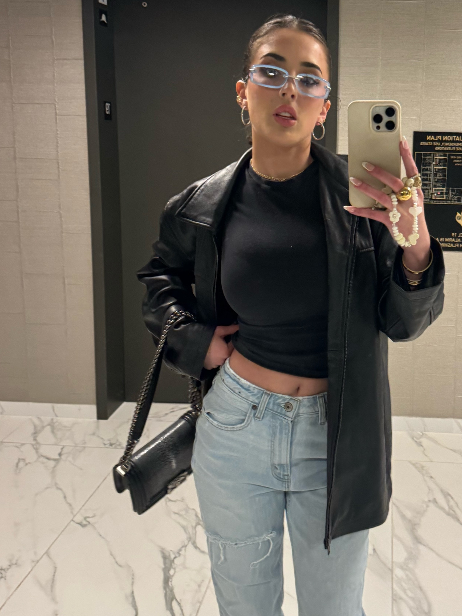 Concert outfit. Wore these tinted y2k glasses with diamond hoops, strung by stroh ear cuff, vintage Chanel Galuchat boy bag in black, Abercrombie jeans in long and went up 2 sizes, Prada patent monolith loafers in black, a black skims fitted tee, and a oversize vintage leather jacket. #y2k #y2kaesthetic #luxury #vintage #concertoutfit #concert #nightout #icon #baddie 

#LTKstyletip #LTKparties #LTKfindsunder100