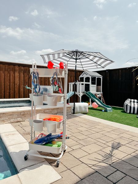 Pool party must haves! This rolling cart is perfect for pool and water toys. The umbrella has lights inside. And the bean bags are everyone’s favorite seat!

#LTKhome #LTKSeasonal #LTKFind