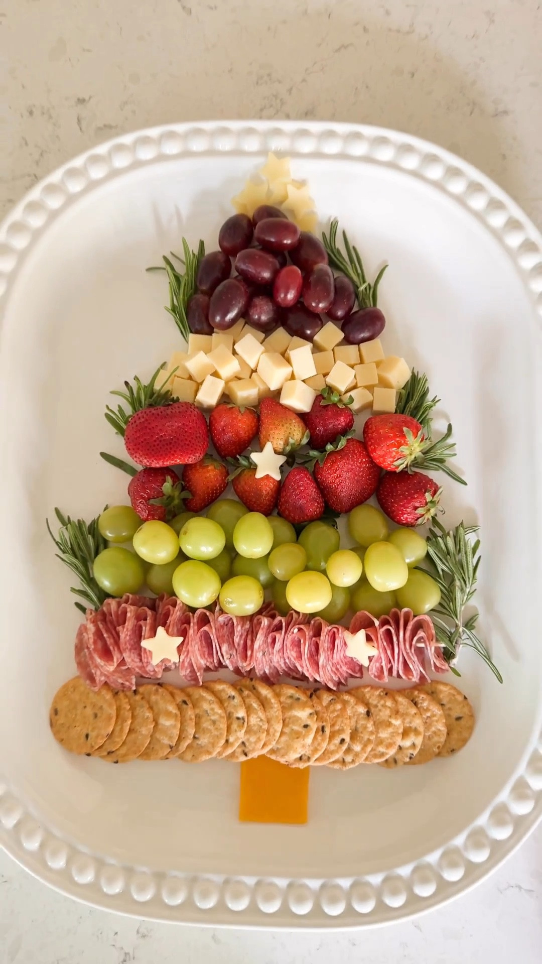Easy TREE-cuterie board! 

Sandwich cutter set, red and green seedless grapes, sliced charcuterie meat, dry salami, strawberries, multi grain crackers, cheese sticks


#LTKHome #LTKHoliday #LTKSeasonal