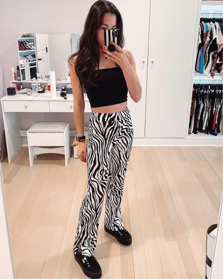 Loving these funky zebra pants! Stretchy material and split hem for extra flare. Paired with a cropped black tank and black platform Superga sneakers. 

#LTKstyletip #LTKunder50 #LTKSeasonal