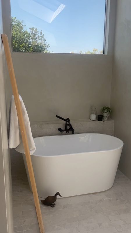 This is what we call bright and earthy. 

Primary bathroom with free standing soaking tub, wall mounted tub filler, rainfall shower head, wooden towel ladder, stone  vase, pendant lighting, and tons of natural light. 

Wet room, luxurious primary bath, tadelakt plaster walls, spa like bathroom, spa inspired bathroom. 

#LTKstyletip #LTKhome