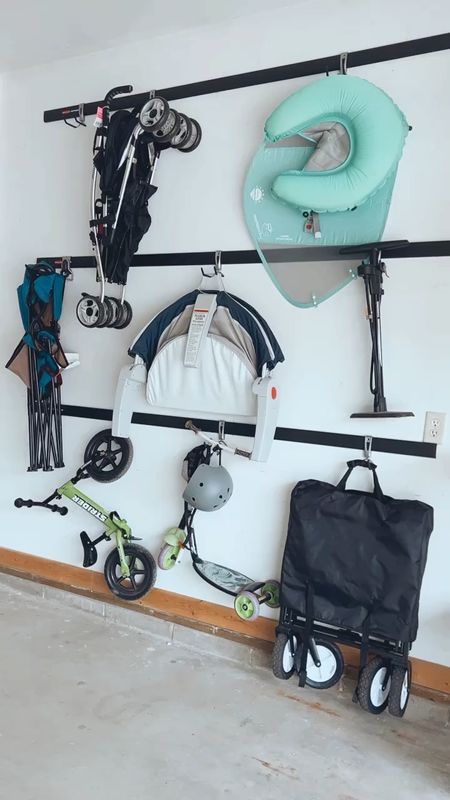 Finally got around to organizing the garage! We got these tracks with hooks so we can use our wall space to hang our strollers, kids bikes, baby gear, etc. You can buy as many hooks as you need and there are a bunch of different sizes! This keeps are garage so much more clean and organized. 

#LTKhome #LTKkids #LTKfamily