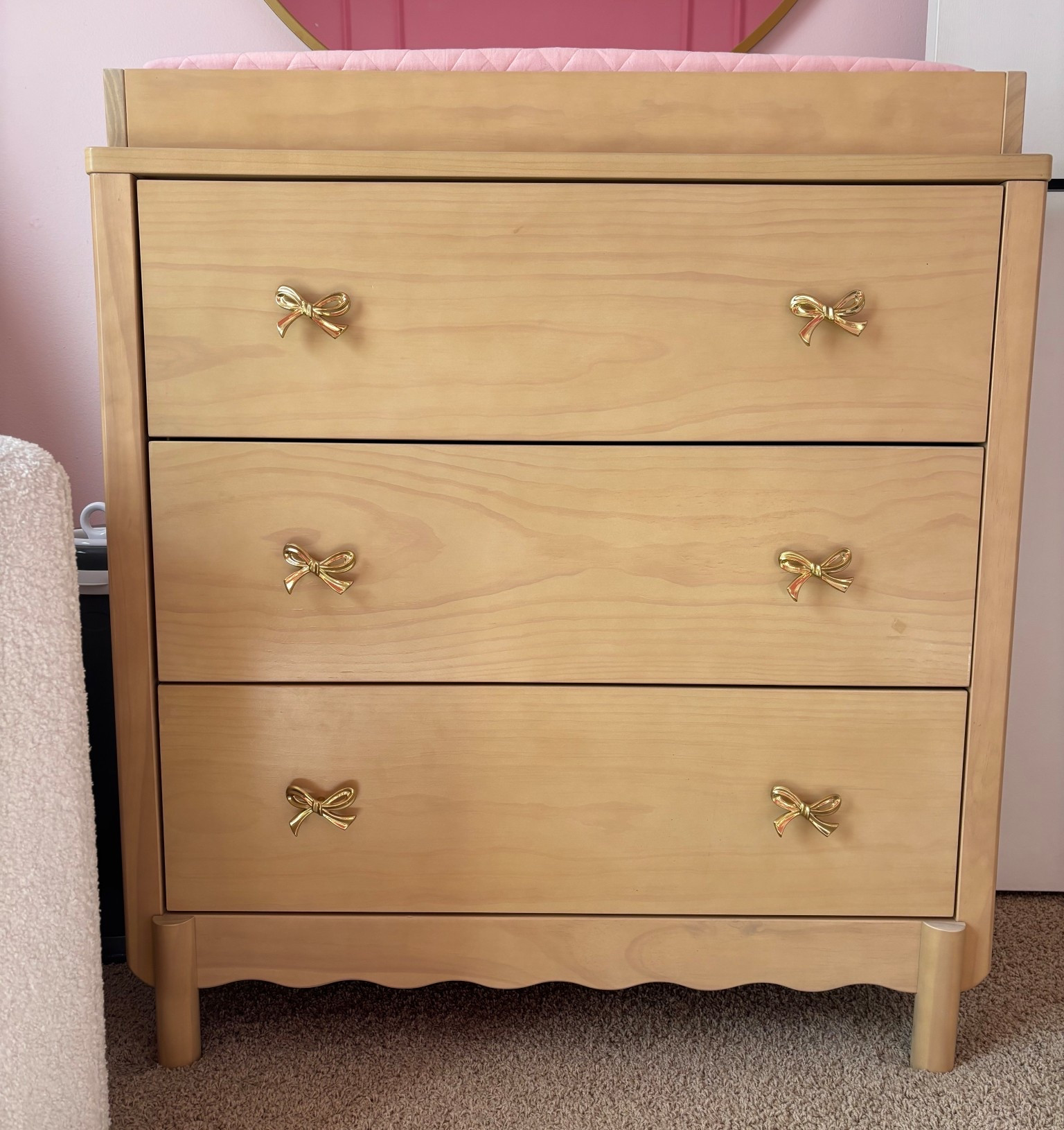Little details that make the sweetest difference 🎀✨ This neutral dresser from Target is the perfect timeless base, and I added these gold bow knobs from Amazon to tie in her soft, feminine nursery theme. I love how it blends elegance with functionality—so many drawers for all the tiny outfits + essentials 🤍🧺

Creating a peaceful, beautiful space for her has been so special… every detail feels like a little love note before she arrives 🕊️💗 #NurseryDetails #BabyGirlNursery

#LTKKids #LTKBaby #LTKHome
