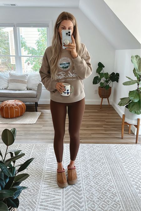 Super cozy fall outfit.

🍁 Crew neck sweatshirt: sz medium
🍁 Ribbed leggings: sz 2 (I linked a lululemon inspired version from Amazon as well) 
🍁 Ugg Tazz slippers: sz 8 (usually 7.5)

Falloutfits - fall outfit - fall style - fall fashion - fall 2024 - neutral fall look - white ribbed leggings - mini ugg boots - fall inspo - fall decor - fall season - sweaters - pullover - jacket - puffer jacket - puffer vest like lululemon - lululemon inspired - early fall outfit - clean girl fall - fall leggings - fall sweater - taupe sweater - Abercrombie & Fitch - thanksgiving outfit - Halloween 

#LTKSeasonal #LTKfindsunder50 #LTKfindsunder100