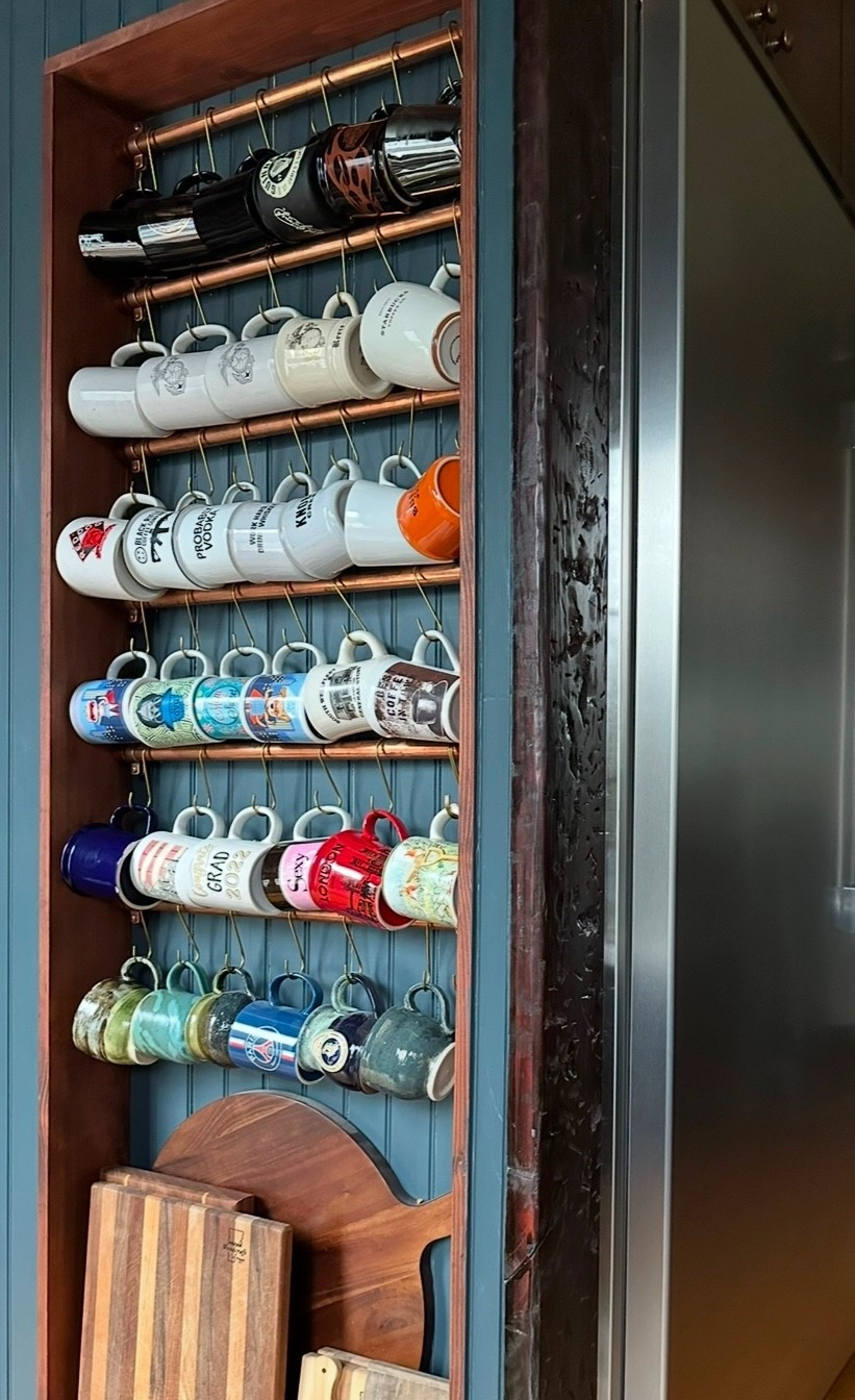 Copper rails that turn a simple mug wall into a warm, functional statement. Rich in tone and beautifully practical, they add character while keeping everyday favorites within easy reach.

#CallSignDesign #Vintage #Luxury #InteriorDesign #InteriorDecorating #Elegance #Chandelier #OldWorldCharm #DesignStyle #CastleCore #OldWorldCharm  #SimpleSwaps