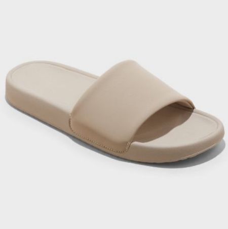 Women’s slide sandals at target $19.99

Pool slides come in tan white pink or black 
Womens shoes 

#LTKSpringSale #LTKfindsunder50 #LTKshoecrush