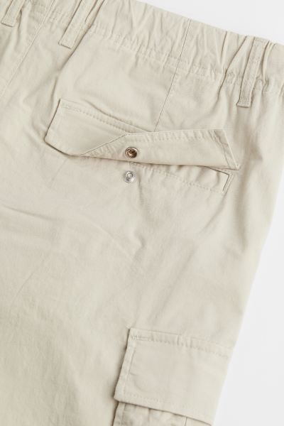 Regular-fit cargo pants in durable, woven cotton fabric. Drawstring and concealed elastic at wais... | H&M (US + CA)