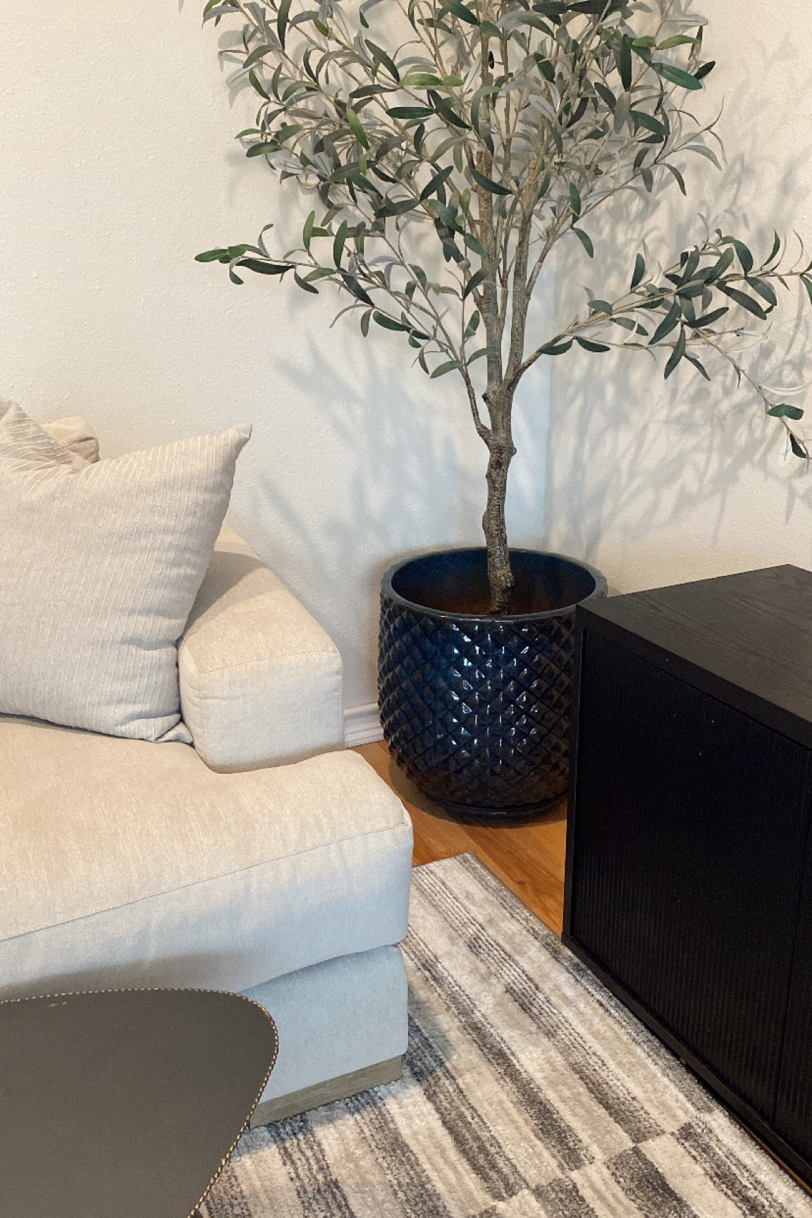 I love adding  unique pieces to my modern home. This deep blue planter adds so much dimension and texture to my living room! Rug, pillow cover, olive trees and media console also linked. 

#LTKFindsUnder100 #LTKHome