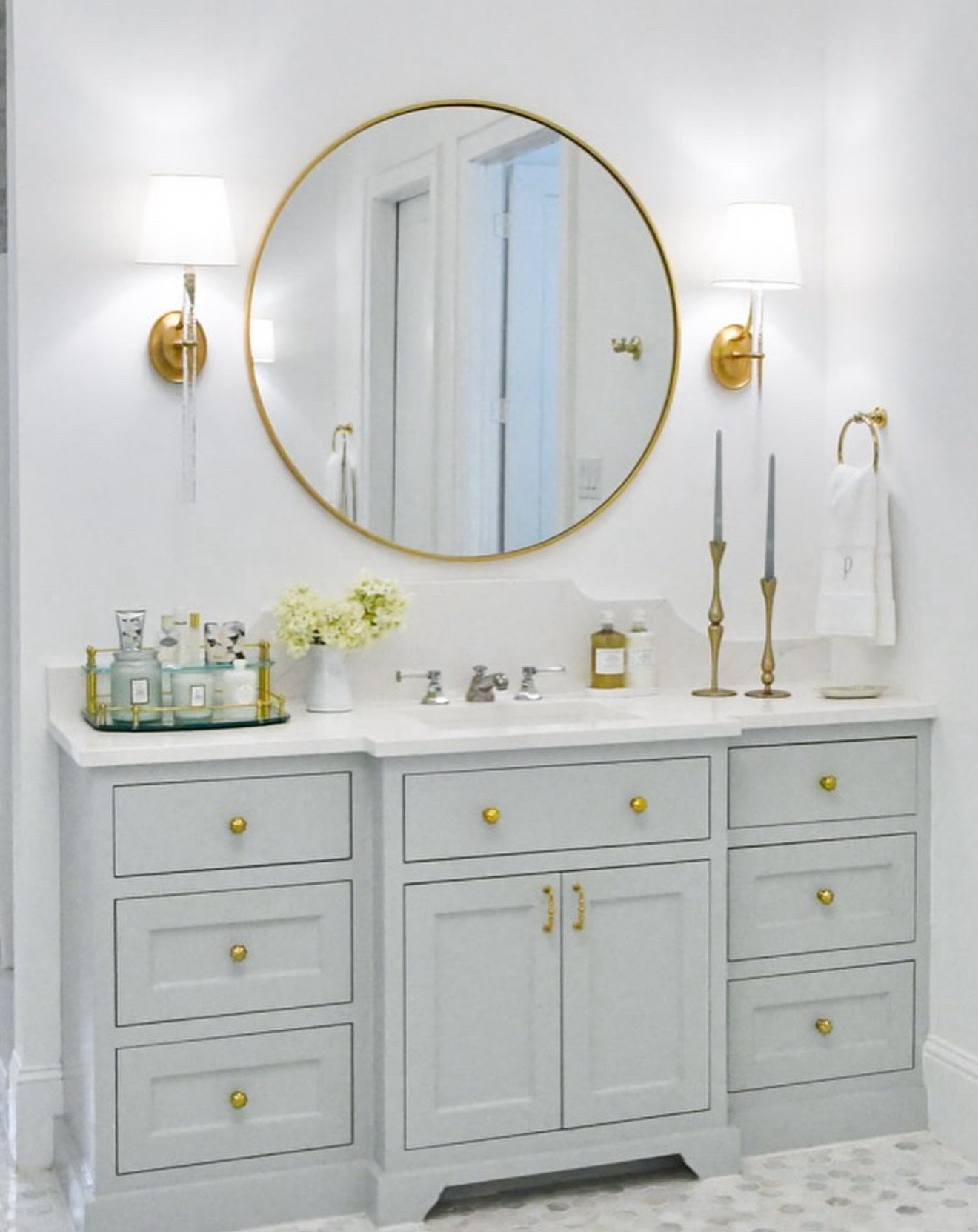 Bathroom decor
Bathroom vanity decor
Round mirror, tray, wall sconces 