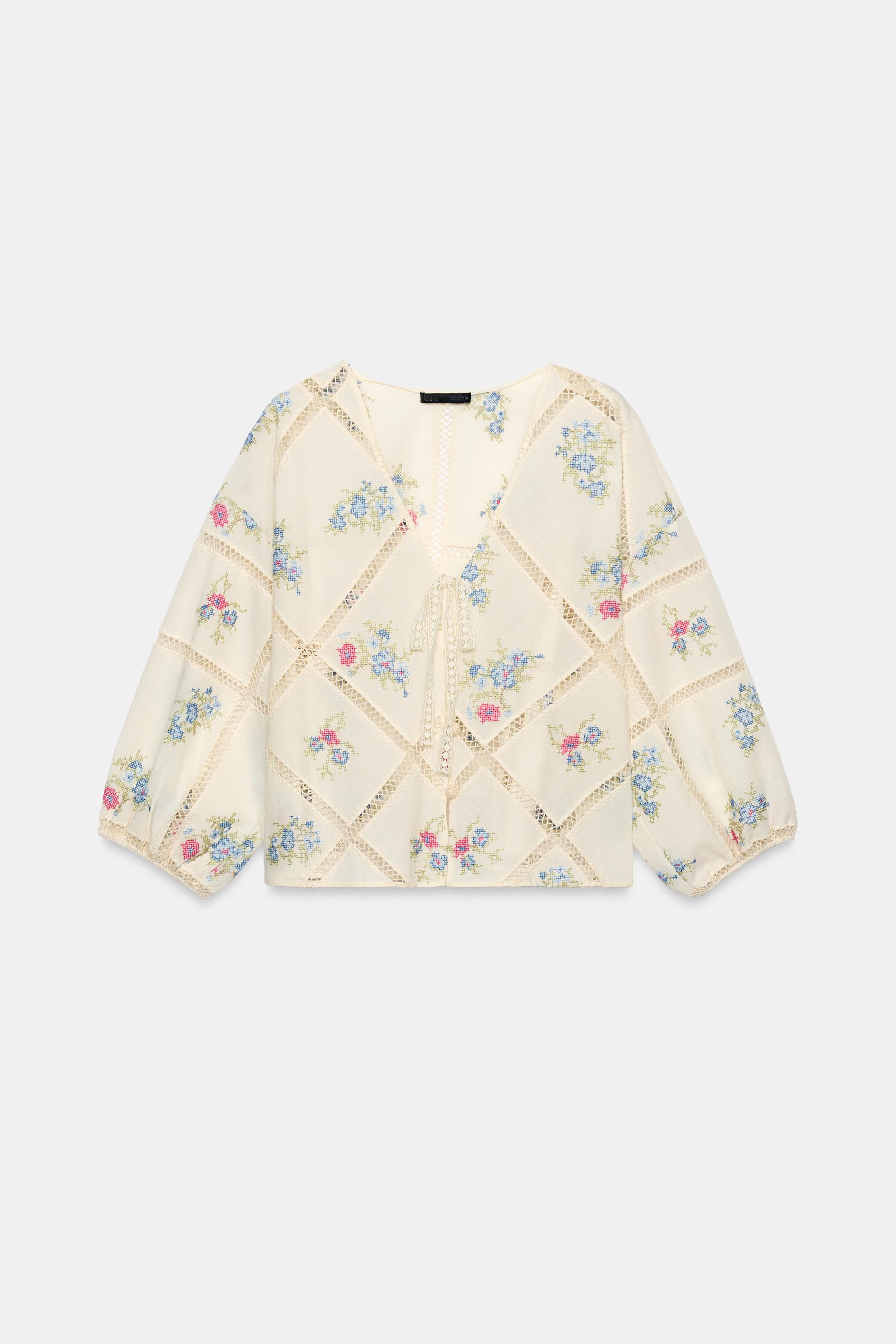Model height: 180 cmV-neck blouse featuring a tie detail and long puffed sleeves with elasticated... | Zara UK