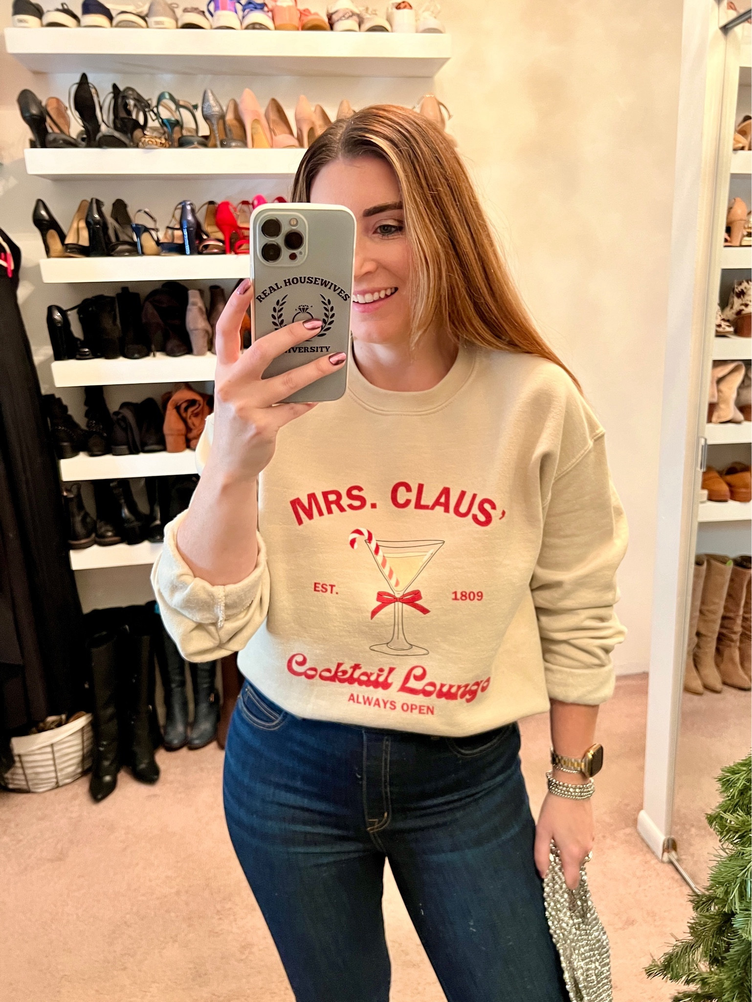 Christmas sweater, Christmas pullover, Christmas sweatshirt, graphic sweatshirt, Spanx pull on jeans, red heels, rhinestone shoes clips, silver beaded handbag, silver bow earrings, rhinestone earrings, workwear, casual outfit, holiday outfit 

#LTKfindsunder50 #LTKHoliday #LTKstyletip