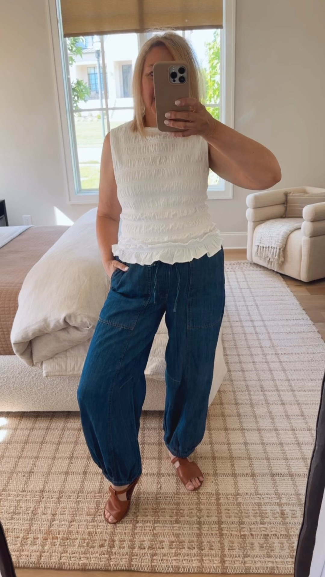 Cute and comfortable summer outfit with this smocked sleeveless top @Target and lightweight gathered ankle pants @oldnavy wearing Medium in both

#LTKootd #LTKOver40 #LTKMidsize