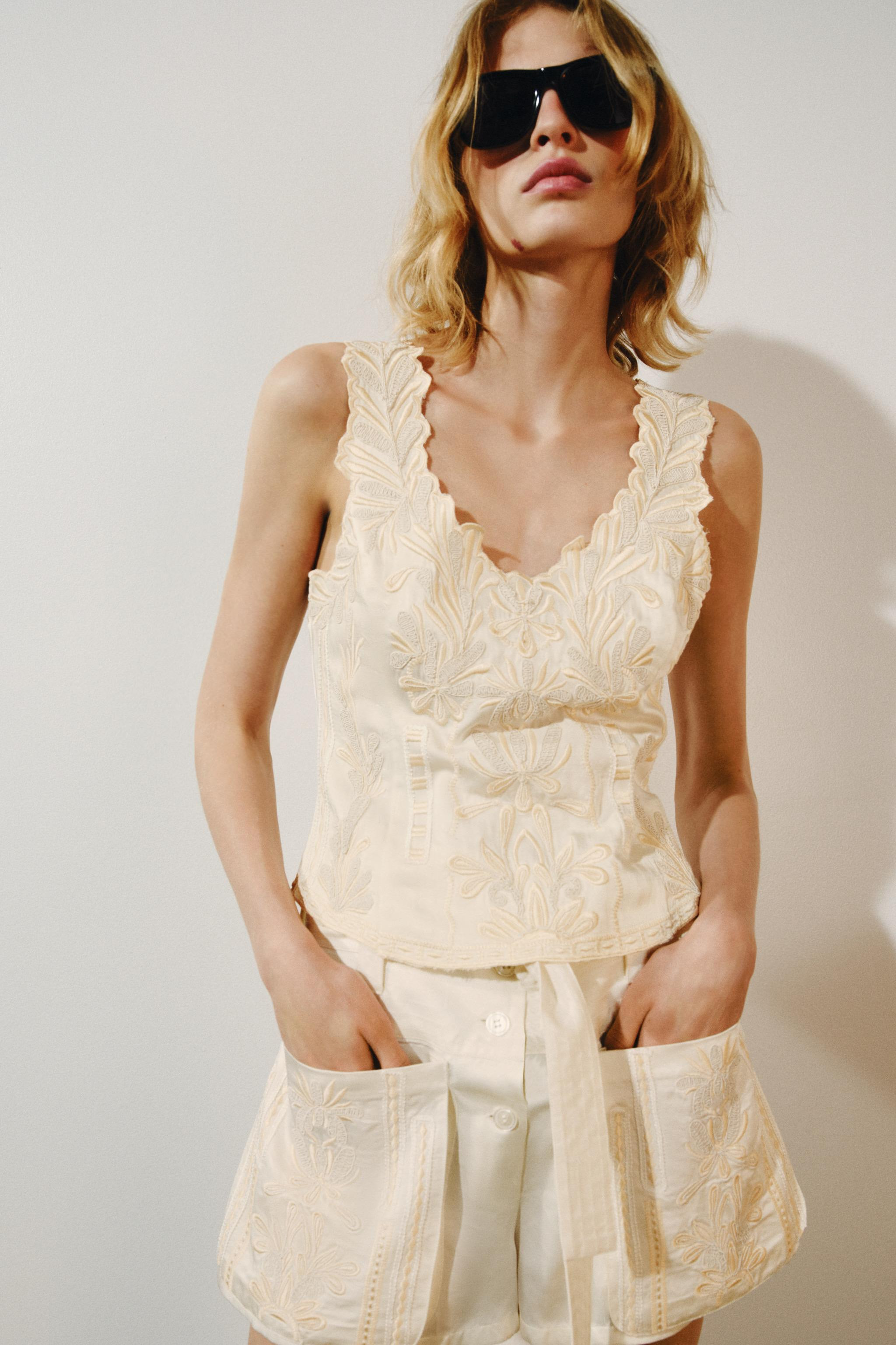 ZARA WOMAN COLLECTIONTop made of 15% linen blend yarn. V-neck and sleeveless. Contrast embroidery... | Zara US