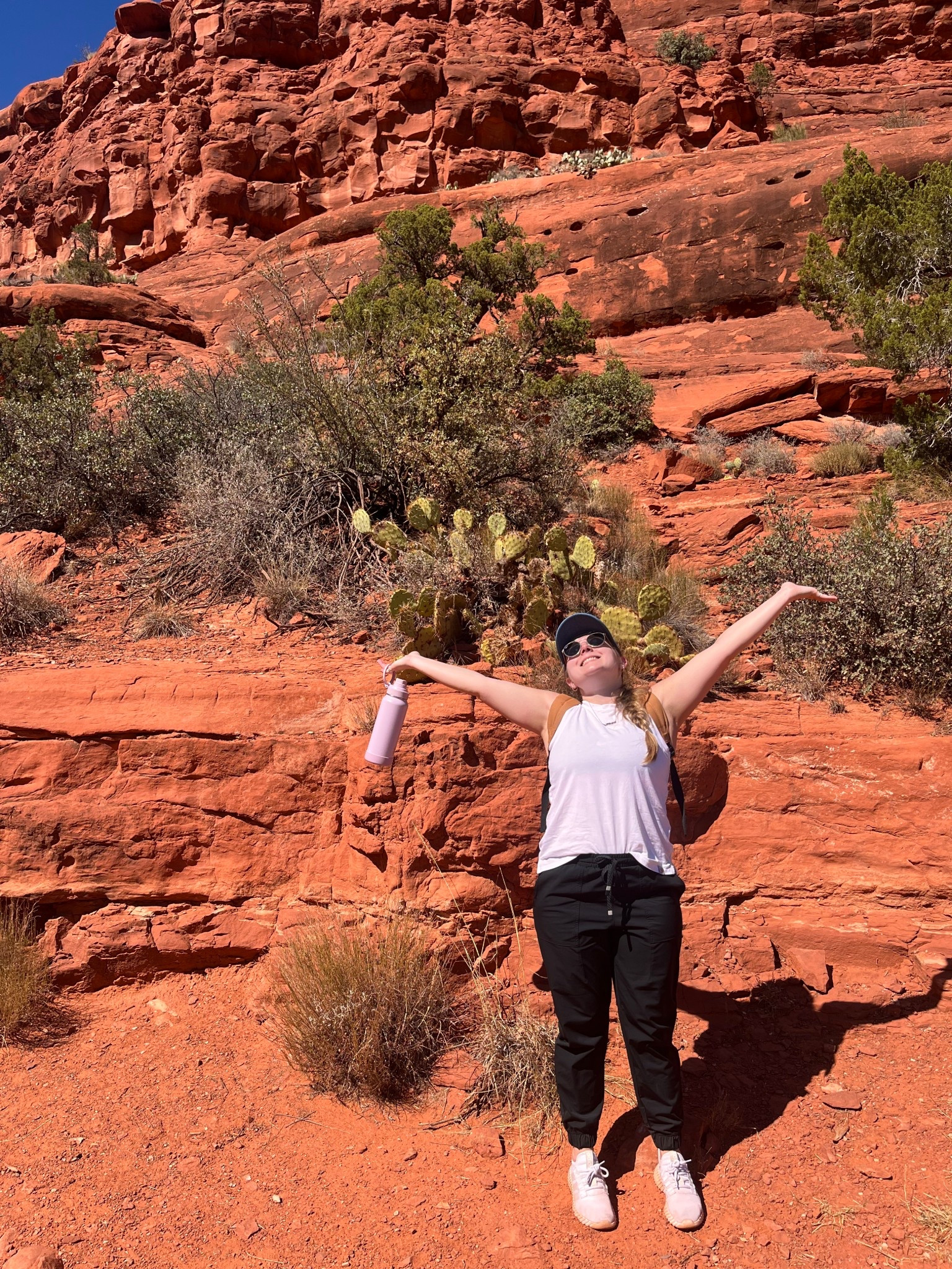Desert hike vibes in full effect 🌵☀️ 

Wearing my favorite athleisure outfit with lightweight joggers, sneakers, Carhartt muscle tank, and my fav denim baseball cap for a day of adventure travel in the red rock desert. This activewear look is perfect for spring hiking, outdoor adventures, or a Southwest road trip! 

I always pack a reusable water bottle, UV-protection sunglasses, and SPF essentials for sunny trails. 

Shop my LTK athletic outfit, casual travel style, and neutral activewear picks for your next vacation hike or Arizona getaway. 🏜️✨ 

#LTKfit #LTKtravel #LTKactive #desertstyle #outdoorfashion #hikingoutfit #traveloutfits #athleisurestyle #springadventures #hikingfashion #outdoorvibes

#LTKSeasonal #LTKTravel #LTKFindsUnder50