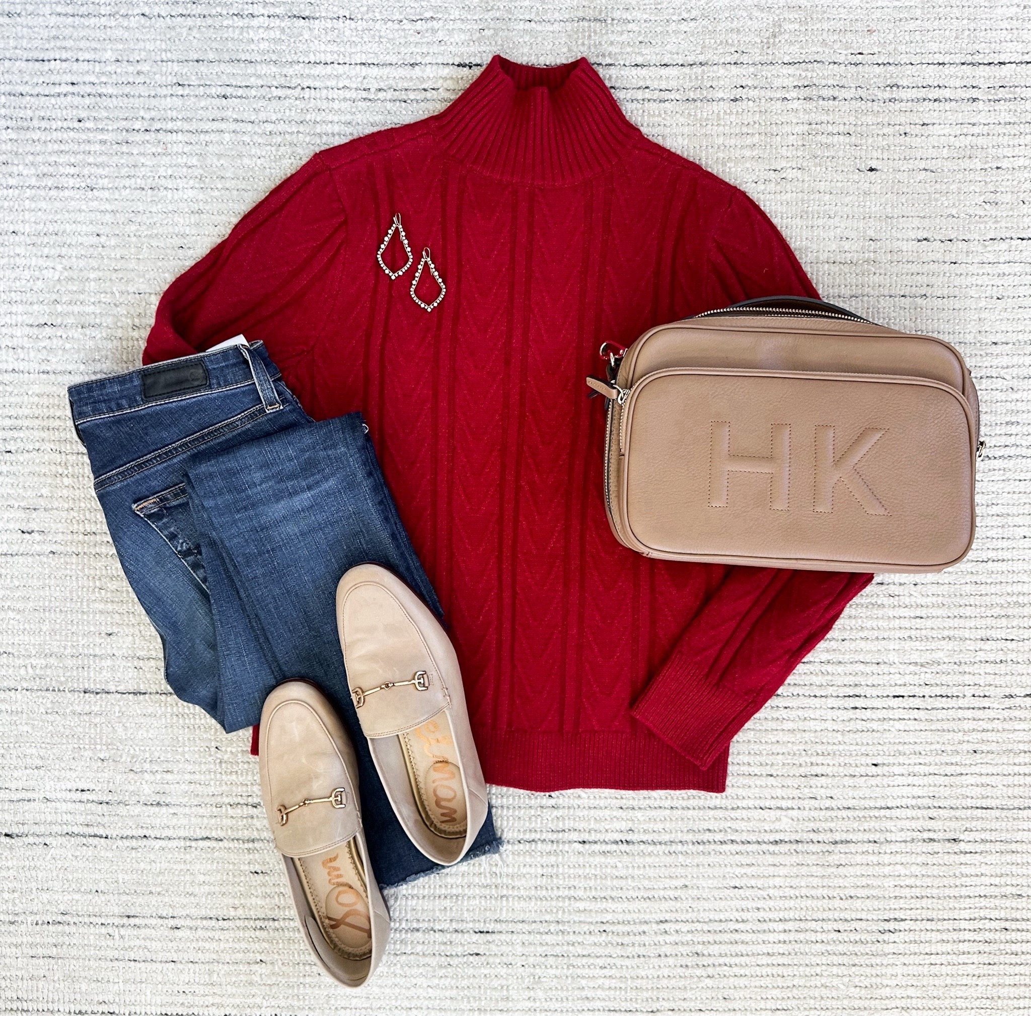 Fall and winter outfit with red mockneck sweater paired with dark skinny jeans and loafers for a classic look. Jeans and sweater are on sale for 50% off.  Perfect for every day wear! 
