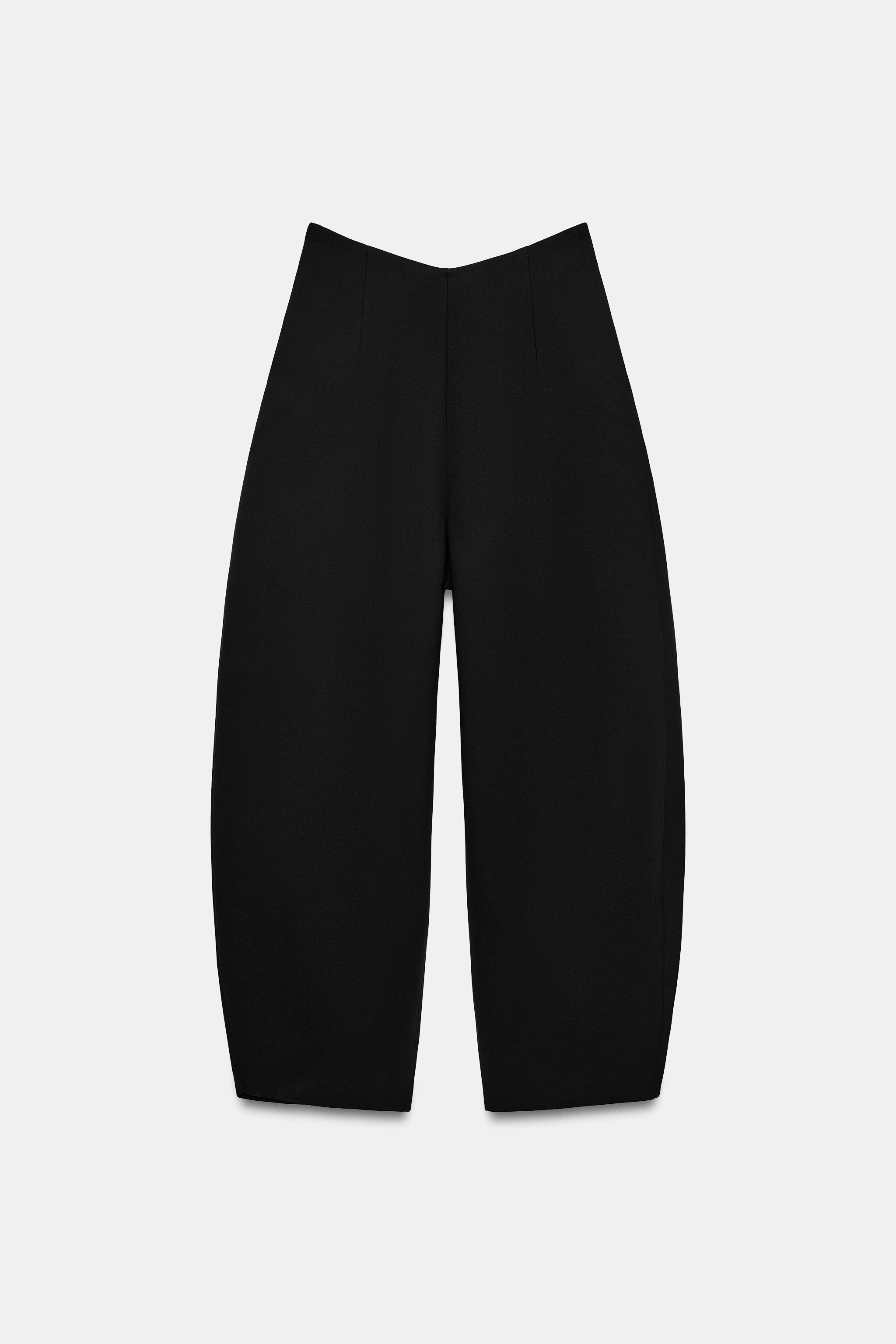 High-waist trousers with an asymmetric waist. Side zip fastening concealed in the seam. | Zara UK