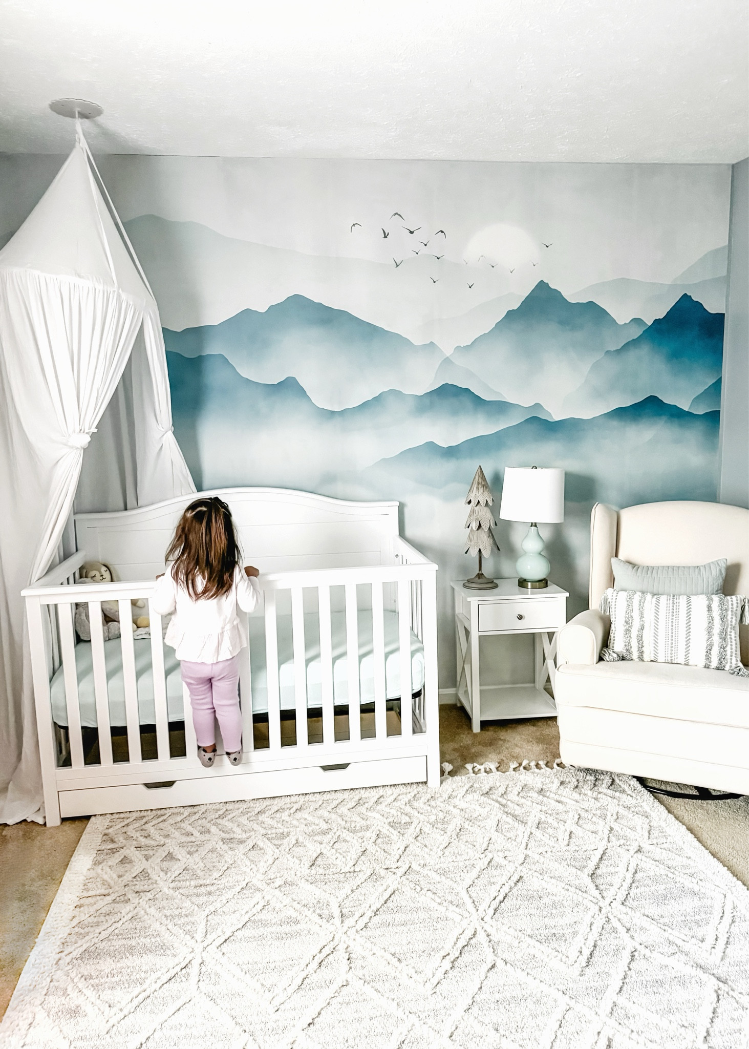 I experienced all of the emotions as I got the nursery ready as part of our adoption process.🤍

I knew I wanted to go with a neutral mountain theme, and this wall mural + furniture and decor brought my vision to life. If you’re interested in a mountain nursery, check out my linked items  

#LTKbump #LTKhome #LTKbaby