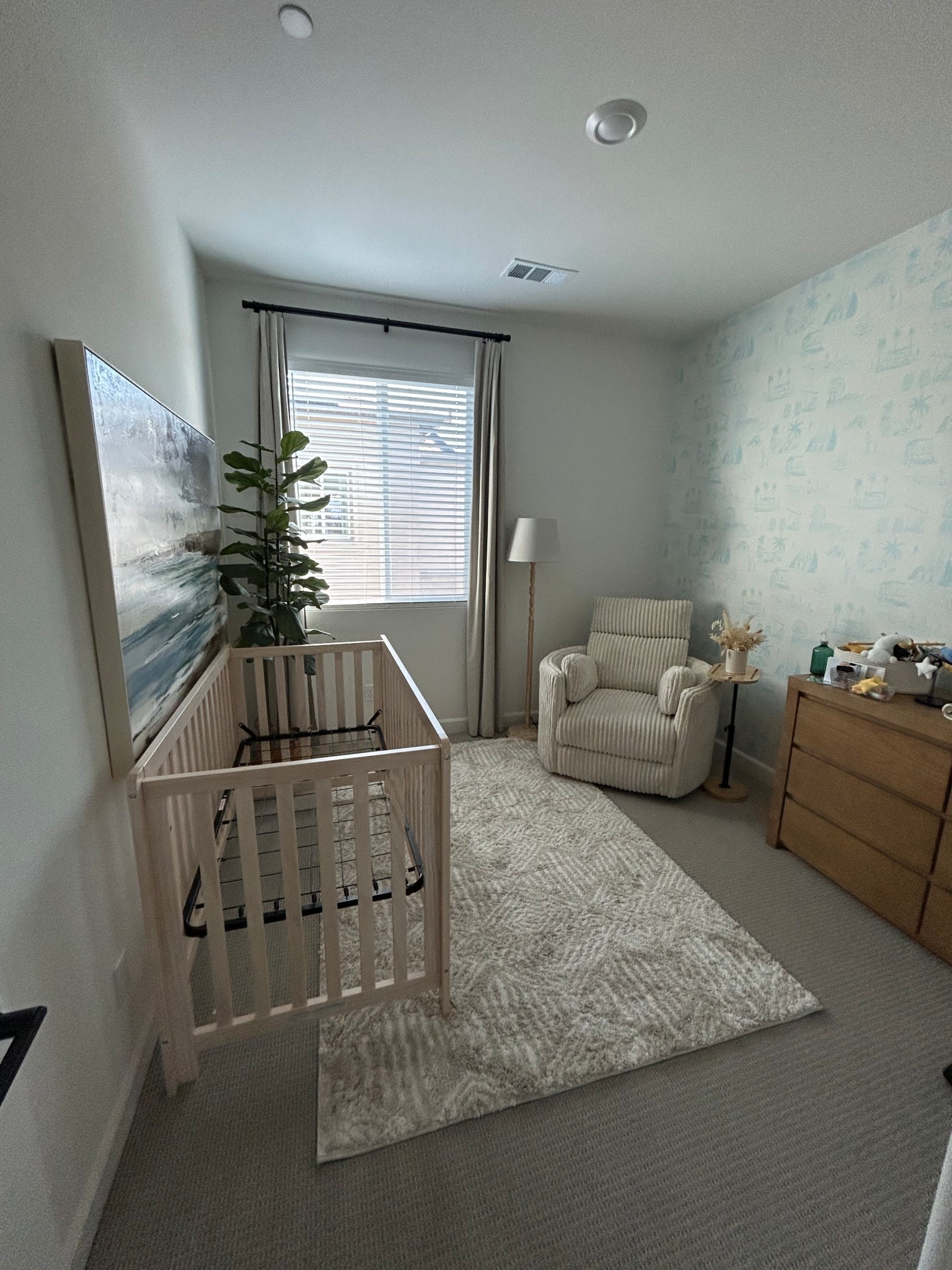 Baby boy’s nursery progress so far! We’re loving how calm and airy this room is and we can’t wait to put the finishing touches on. 

Linking everything I can and here are details for other things I can’t link:

Dresser - Nora dresser from Living Spaces
Chair - Rayna (Ivory Plush) from Living Spaces
Lamp - KINNAHULT from IKEA
Wallpaper - Retro Surf pattern from Love vs Design (colors: cotton, porpoise) 
Rug - Macy Neutral Diamond Design Shag Area Rug, 5x7

Baby boy, nursery decor, baby nursery, nursery inspo, baby room, beach nursery, surf nursery, blue nursery, nursery finds, Amazon finds, Amazon baby, Amazon finds

#LTKBaby #LTKHome