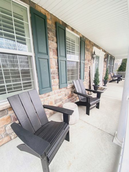 Front porch styling:
Black Adirondack Chairs
Cement side tables
Faux cedar tree topiaries

#LTKhome
