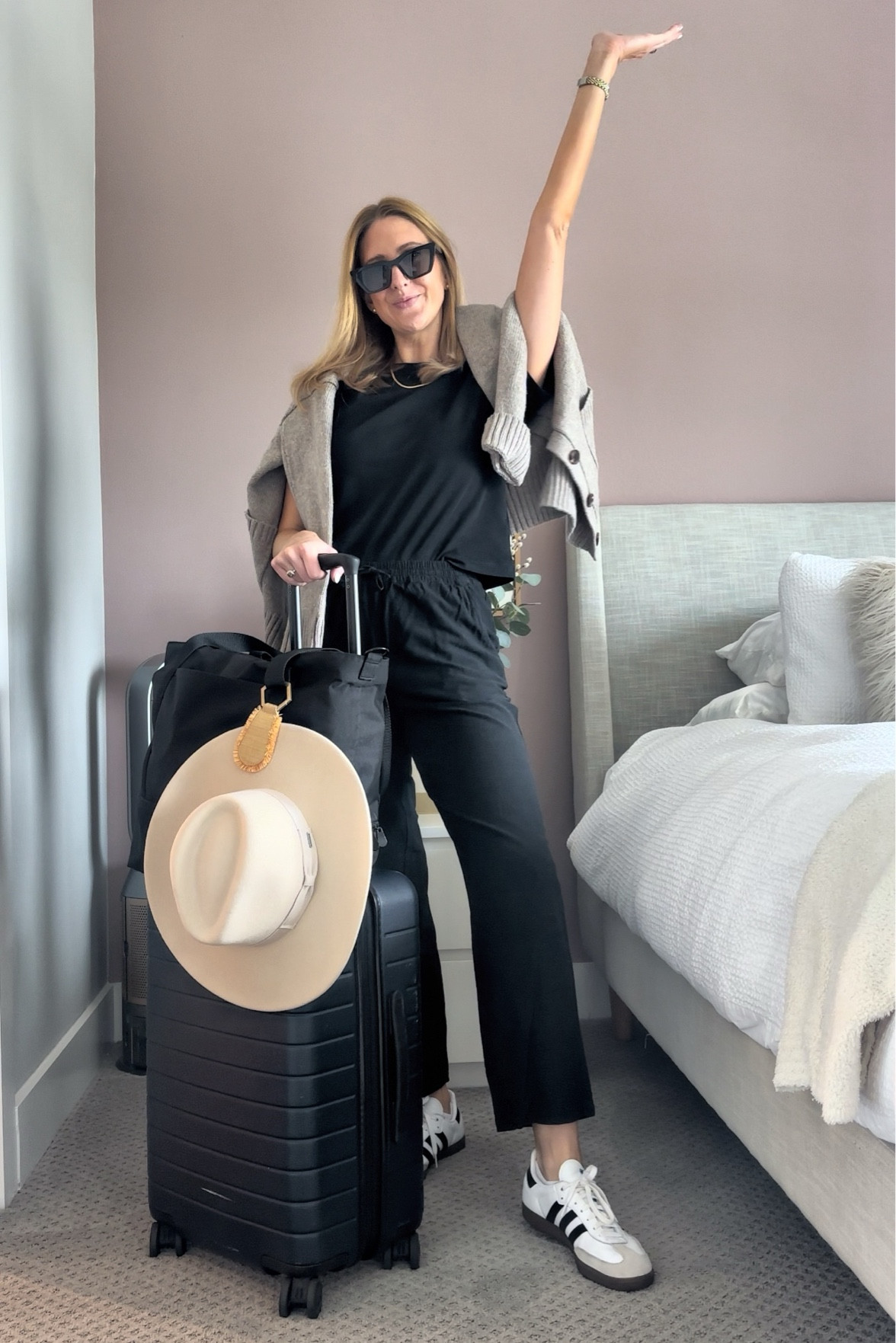 Travel day outfit! My away suitcase and Lo and Sons tote are always with me. Since I wanted to bring this fun hat I used my hat clip that I LOVE! And a simple black outfit since I always tend to spill on myself 🤣

#LTKStyleTip #LTKFindsUnder100 #LTKTravel