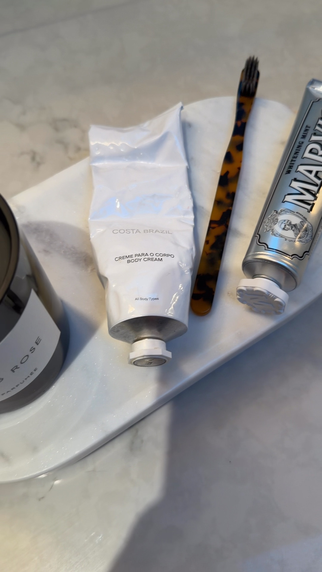 Bathroom, accessories, toothbrush, toothpaste, luxury candle, handcream, marble footed tray.

#LTKSaleAlert #LTKHome