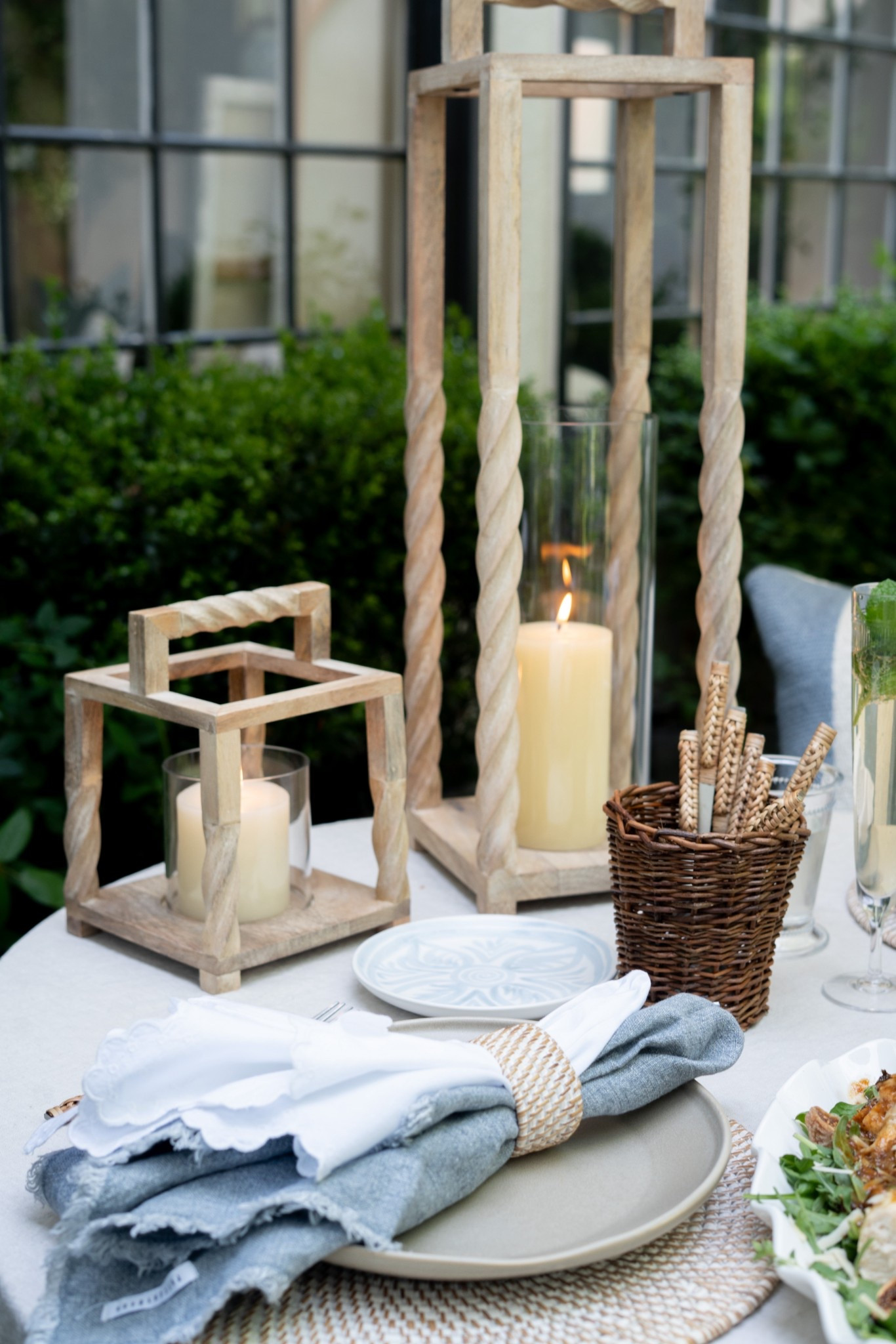 Guys, this is what afternoons are made for! Gorgeous wood lanterns, flickering candles, layered linen napkins, and the prettiest little plates—all set against a backdrop of green hedges and golden light. It's simple, it's slow, it's gathered. Pure magic for an evening outdoors! 

#LTKdayinmylife #LTKSeasonal #LTKHome