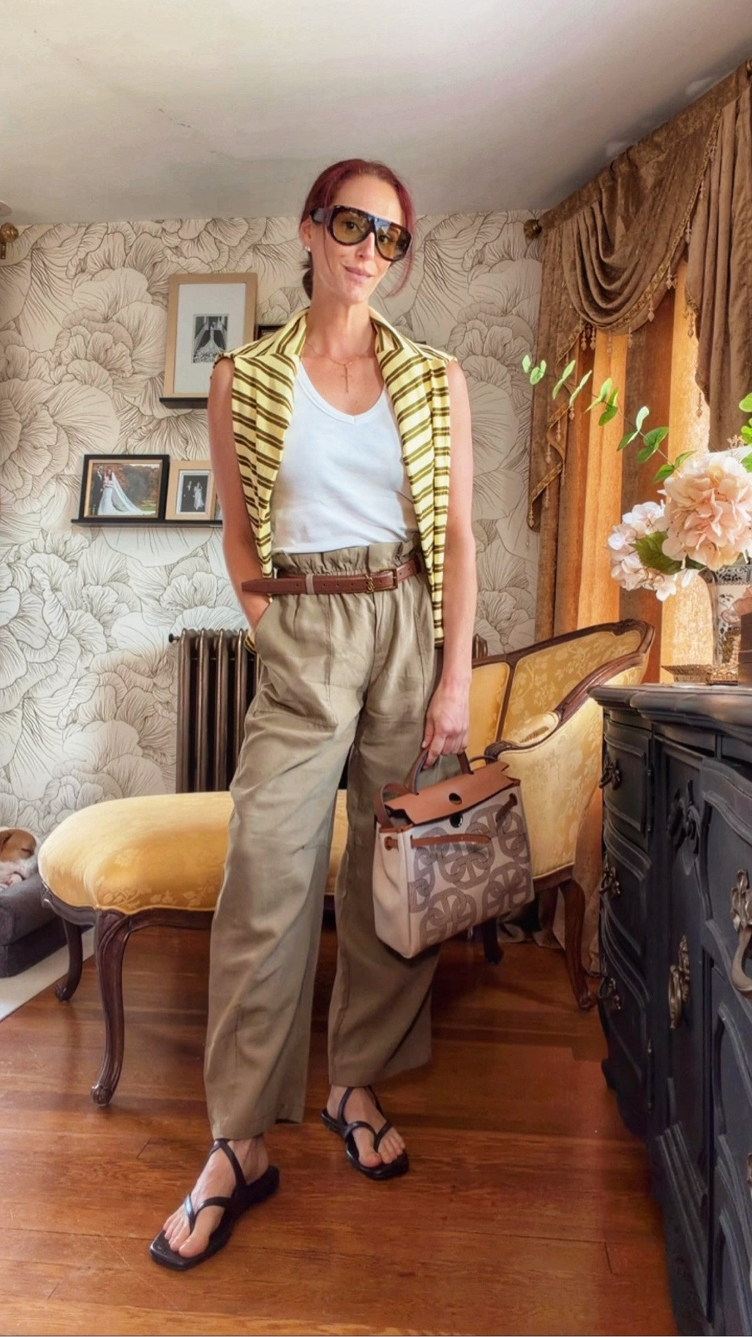 Today’s outfit 🤎

Playing with proportion and styling today — relaxed paperbag trousers, a simple white tank, and a striped knit worn over the shoulders instead of as the main layer. The belt gives the looser silhouette some structure, while the oversized sunglasses, structured bag + barely-there sandals keep it polished.

Proof that the simplest wardrobe pieces can feel completely different depending on how you style them.

Everything linked on LTK!

#EverydayStyle #TransitionalStyle #FallOutfitIdeas #PersonalStyle #WardrobeStyling #LTKStyle