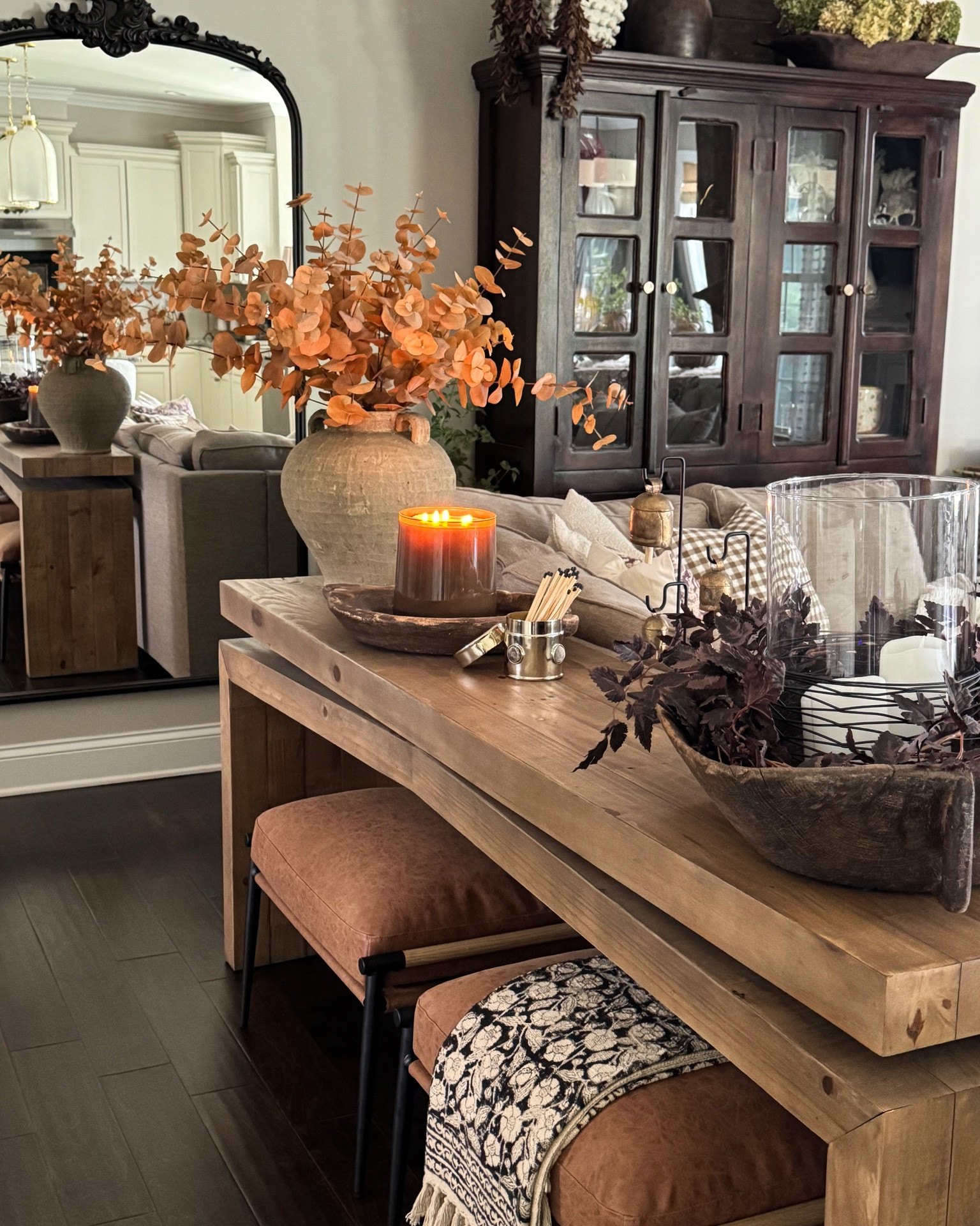 Cozy Fall Living Room

Ottomans, console table, brown case, toasted eucalyptus, brass canister, matches, bells with stands, vintage wood bowl, plum garland, clear glass cylinder, flameless candles, floor lamp with woven shade, floral throw blanket, woven storage boxes, throw pillows, wood dough bowl, 100 oz candle, upholstered chair, pedestal bowl, dried gourds

#LTKstorytime #LTKSeasonal #LTKHome