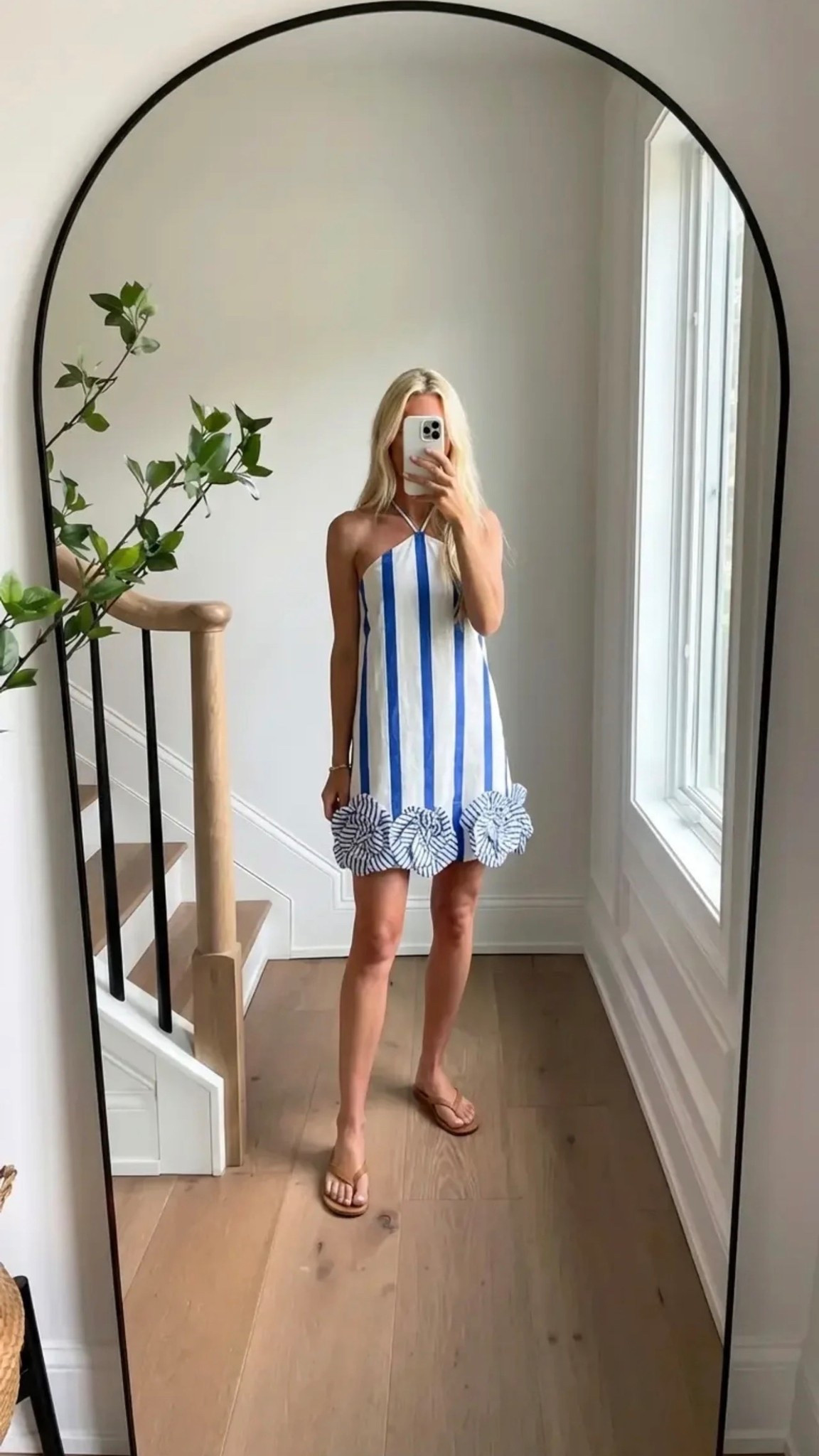 minimalist mirror selfie / modern neutral home / arched mirror aesthetic / natural light streaming / effortless luxury style / red monochrome outfit / fitted crop top + midi skirt / rosette details / clean girl aesthetic / gold jewelry accents / casual chic with flip flops / blonde hair loose waves / elevated everyday elegance / pinterest worthy composition / soft shadows / calm refined vibe

Hashtags:
#SoraStyle #MinimalistAesthetic #CleanGirlLook #RedOutfit #ChicStyle #EffortlessFashion #NeutralHome #MirrorSelfieStyle #ModernElegance #PinterestOutfit #SummerStyle #CapsuleWardrobe #QuietLuxury #StyleInspo #OOTDInspo

Words ( / separated ):
elevated / feminine / sleek / minimal / refined / modern / effortless / polished / chic / monochrome / bold / flattering / soft / luxe / clean / timeless / aesthetic / natural / airy / sophisticated

#LTKdayinmylife #LTKFestival #LTKgrwm