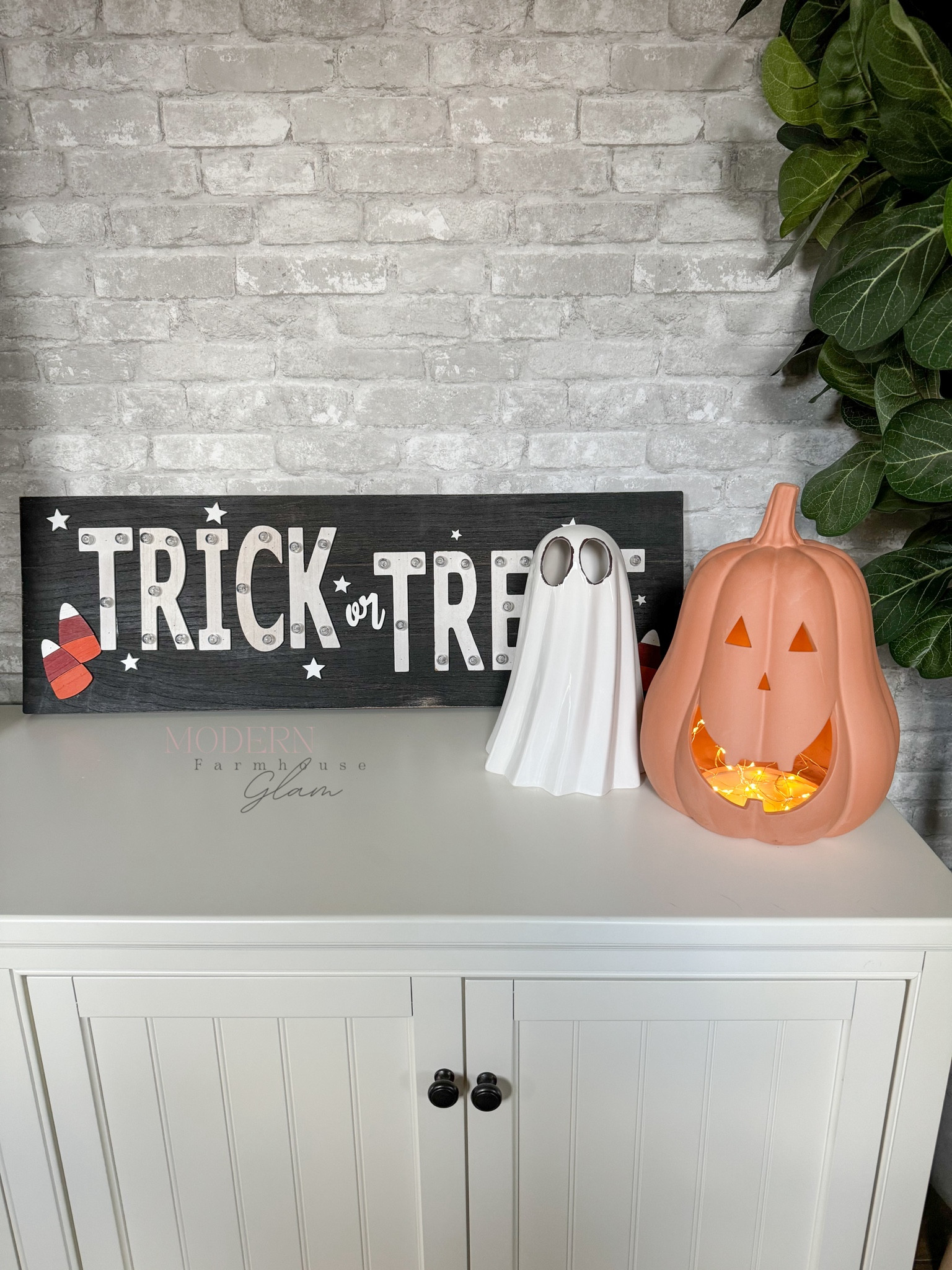 Viral Walmart Terracotta pumpkin at Modern Farmhouse Glam. I added fairy lights. Peel and stick brick wallpaper. Console table  Pottery Barn 

Fall home decor Halloween 

#LTKFallSale #LTKSeasonal #LTKHome