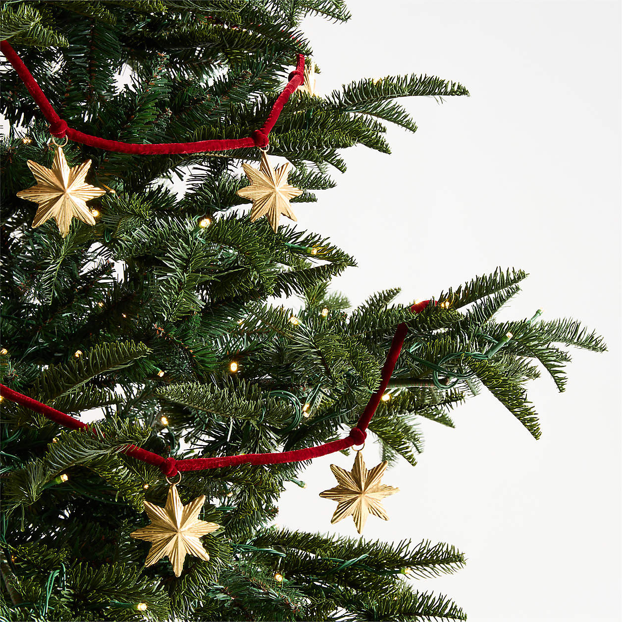 Brass Star & Red Velvet Christmas Garland | Crate & Barrel | Crate & Barrel