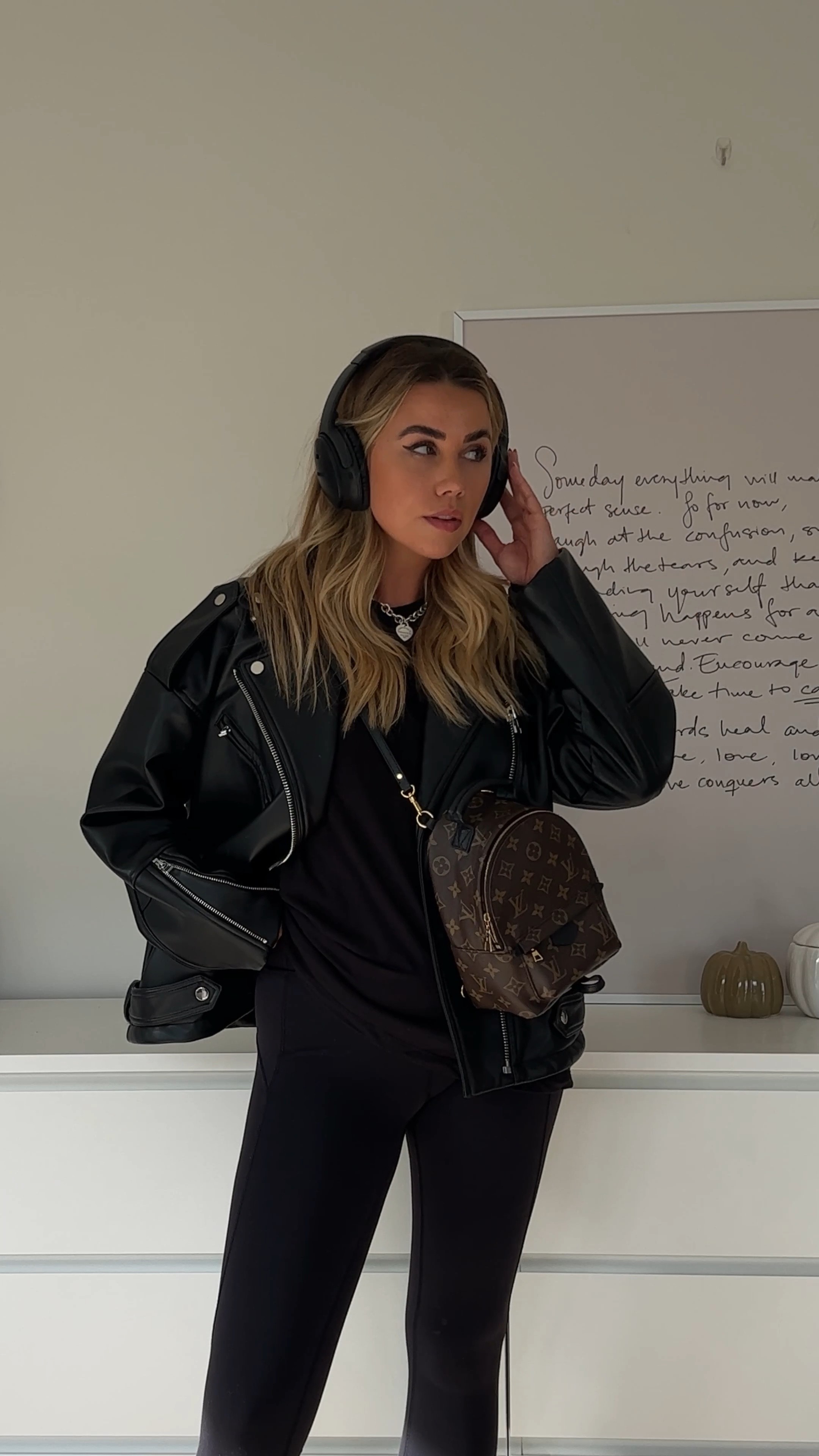 Styling a black oversized leather jacket with oversized mens T-shirt and lululemon leggings, teamed with ultra low uggs in chestnut and Bose over headphones 🖤 All black outfit for everyday - casual style - casual outfit - basic style - simple outfit 

#LTKunder50 #LTKunder100 #LTKstyletip