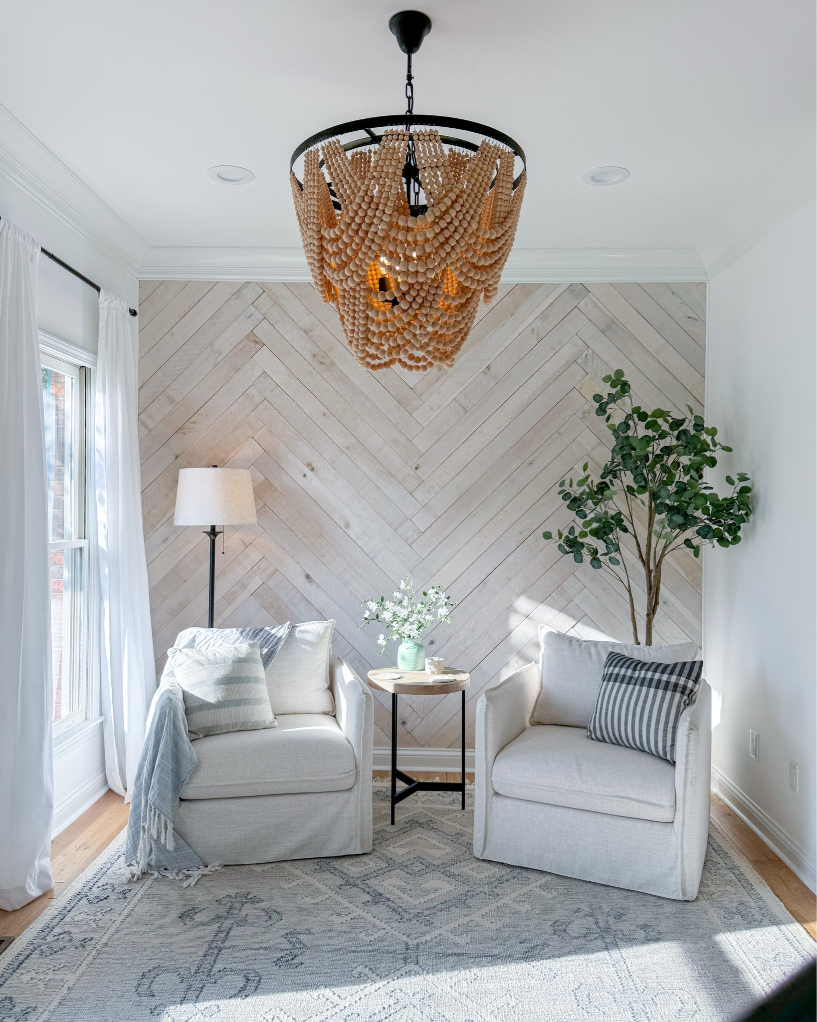 Sitting room details ✨

**I spray painted the chandelier hardware black fyi!

#LTKHome