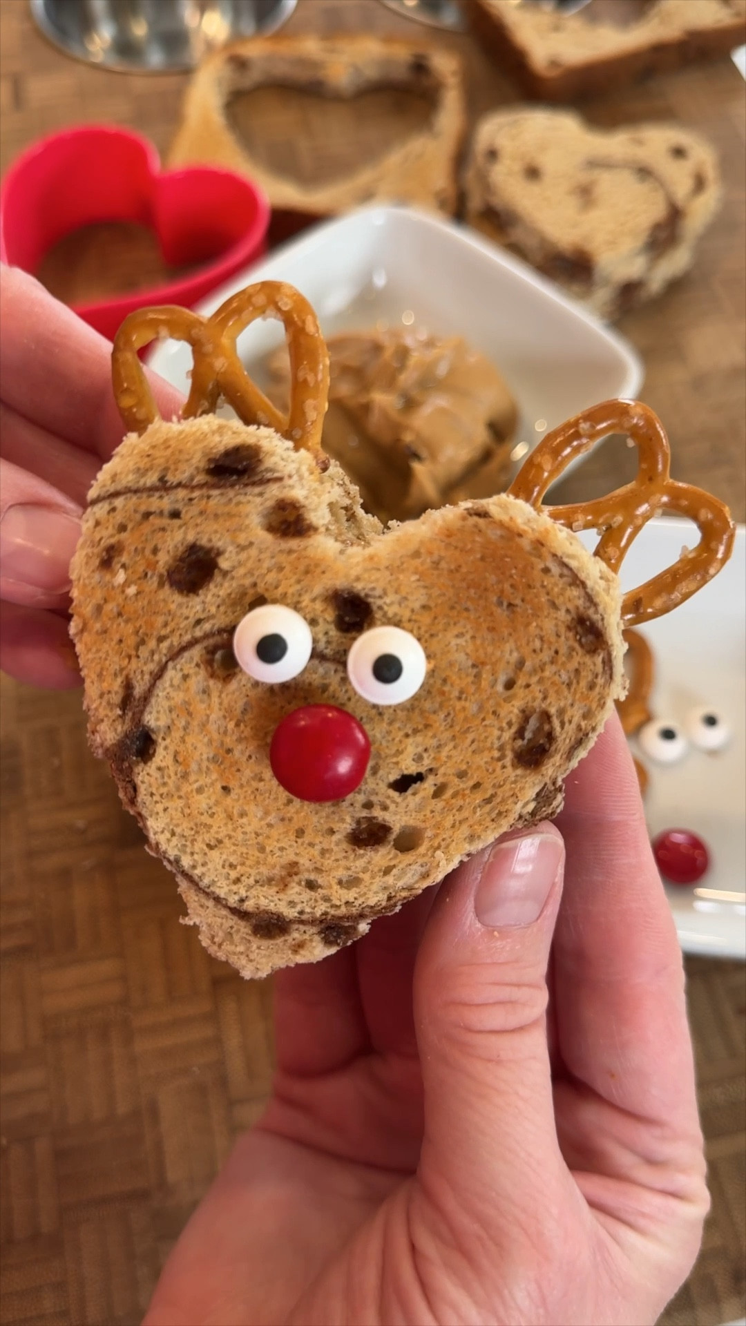 Make lunchtime merry and bright with these adorable Reindeer Sandwiches—the perfect festive holiday treat! 🦌✨ Use a heart-shaped cookie cutter on cinnamon bread, then add candy eyes, a red M&M nose for Rudolph, and pretzel antlers to complete the look. Easy, fun, and sure to bring holiday cheer to your little ones! 🎄🎅 #FestiveFood #HolidayLunch #ChristmasFood #HolidayIdeas #FestiveLunch 

#LTKKids #LTKHoliday #LTKFamily #LTKHoliday #LTKHome