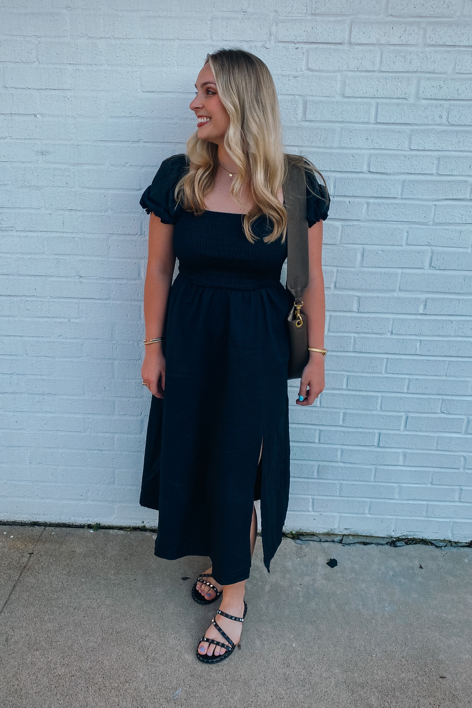 Amazon black midi dress with puff sleeves! 

Love the length of this dress with the slit and ruching! 

#LTKFindsUnder50