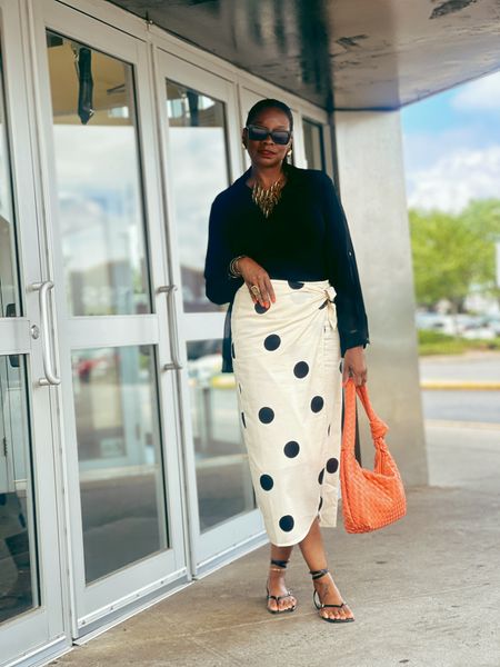 Polka dot skirt with black tank and flat sandals 

#LTKStyleTip
