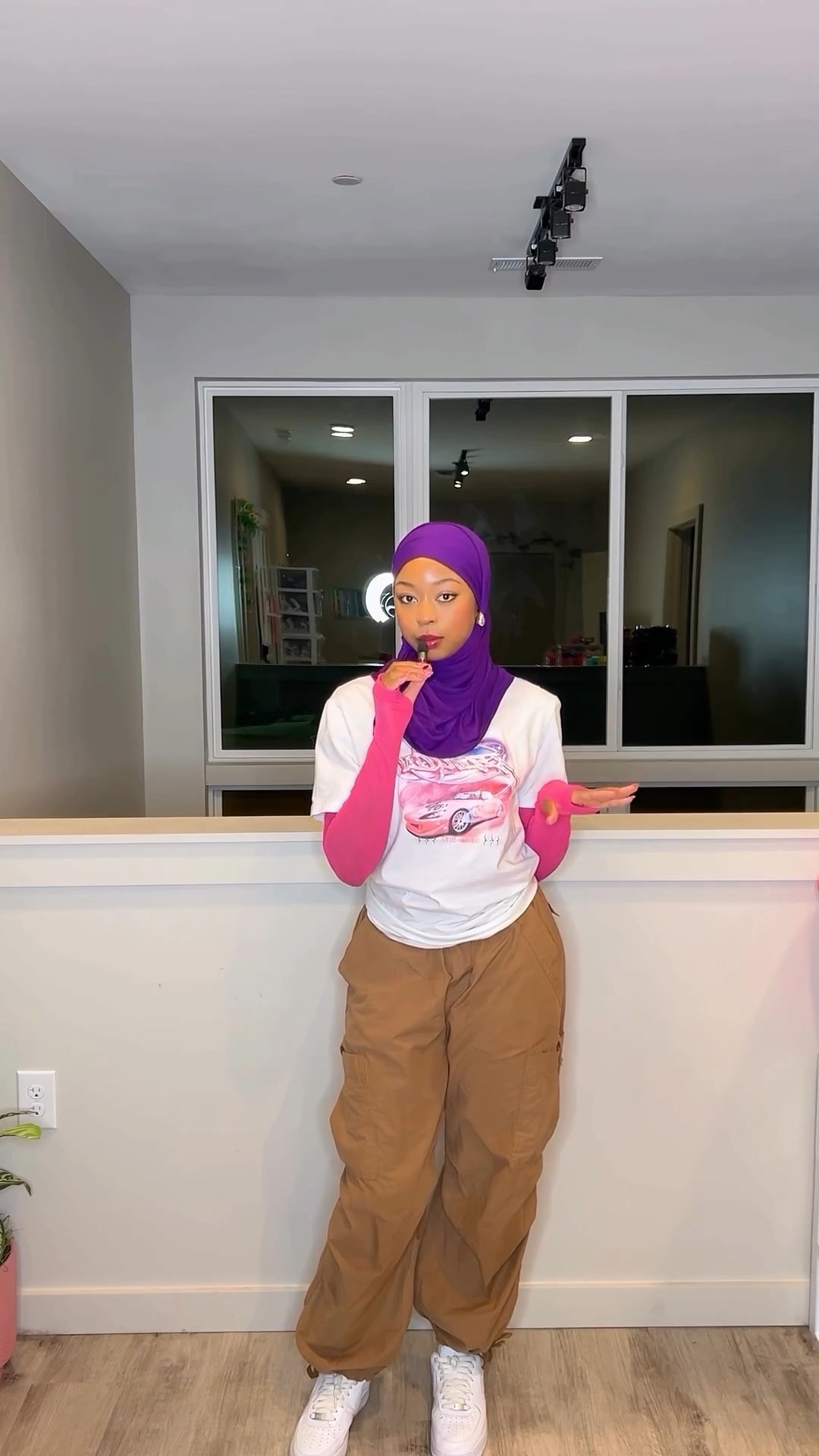 Streetwear Outfit

Purple Hijab
White and Pink Graphic Tee
Tan Cargo Pants 
AF1 