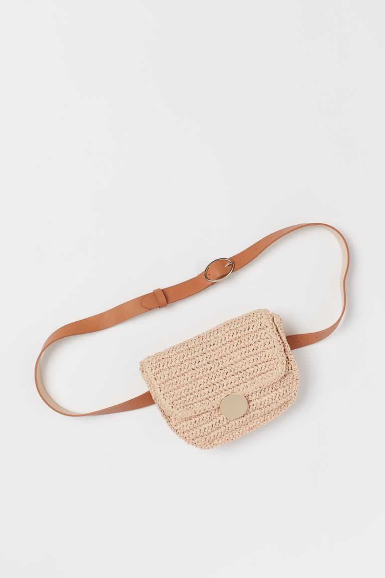 Belt bag in braided paper straw with adjustable waist strap in faux leather. Flap with concealed ... | H&M (US)