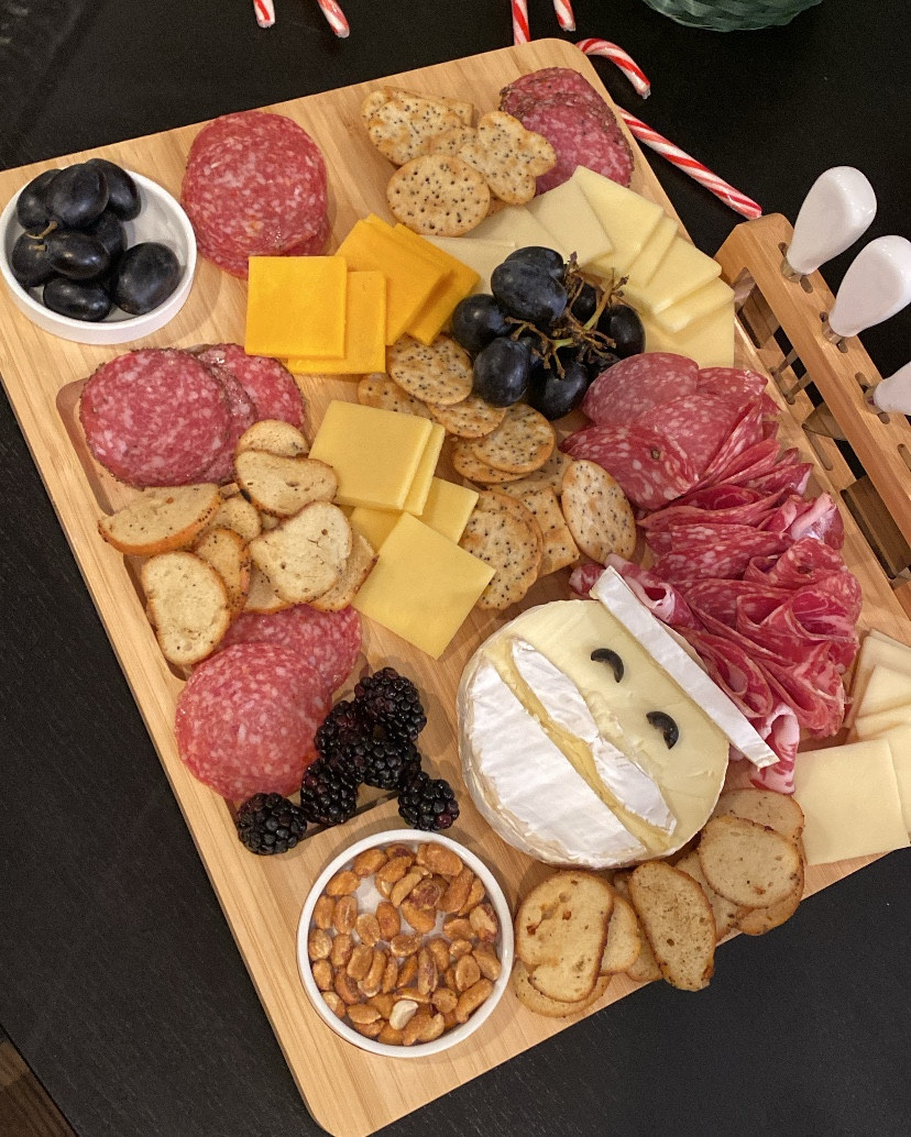 Did someone say snack time? 😋
My go-to for any holiday event is a charcuterie board full of meat and cheese paired with a little wine! 🧀🍷This is my favorite cheese board that I’ve ever owned, and it even comes with extra dishes and slicing/scooping tools. 

#LTKHome #LTKFindsUnder50 #LTKParties